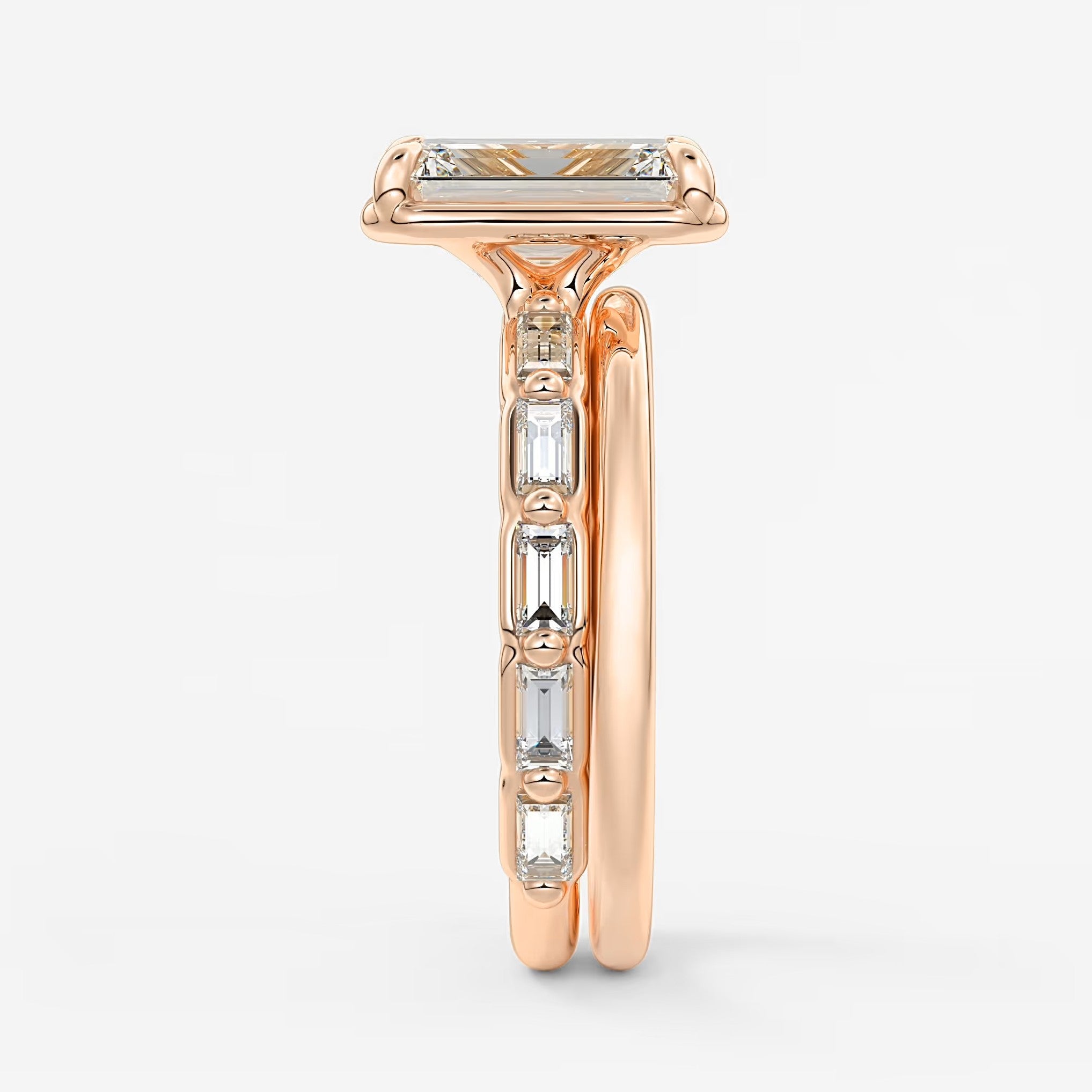 Isadora emerald bezel baguette engagement ring