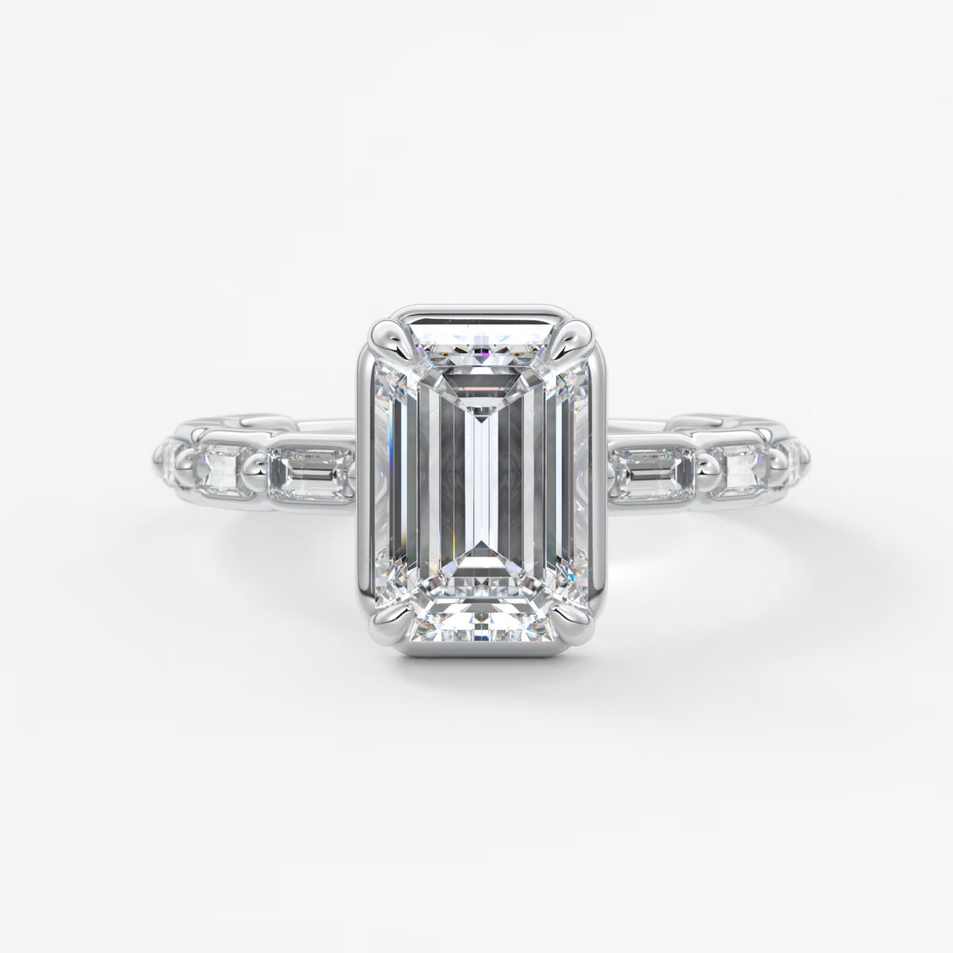 Isadora emerald bezel baguette engagement ring
