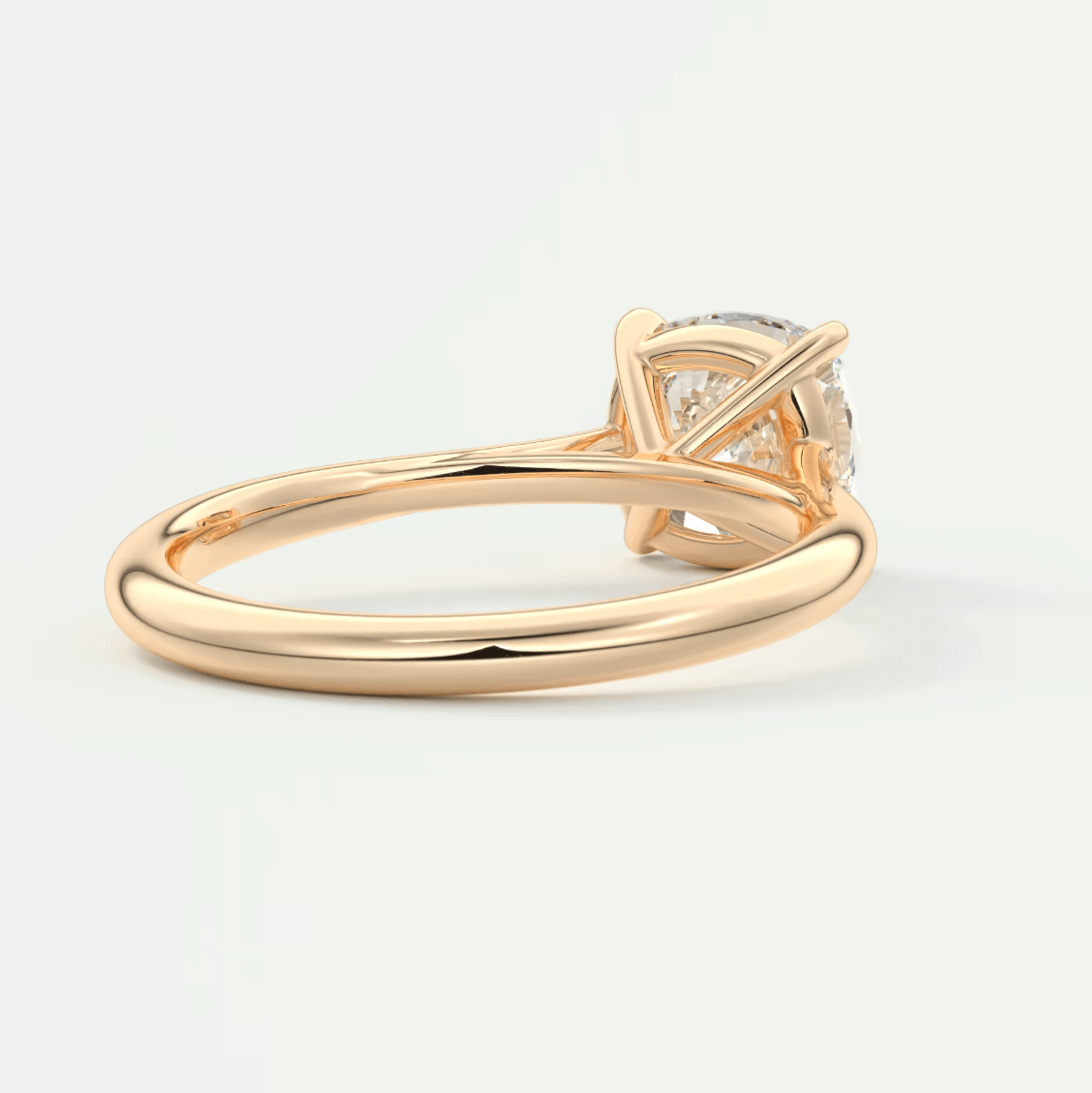 18k rose gold engagement ring with a princess cut diamond.