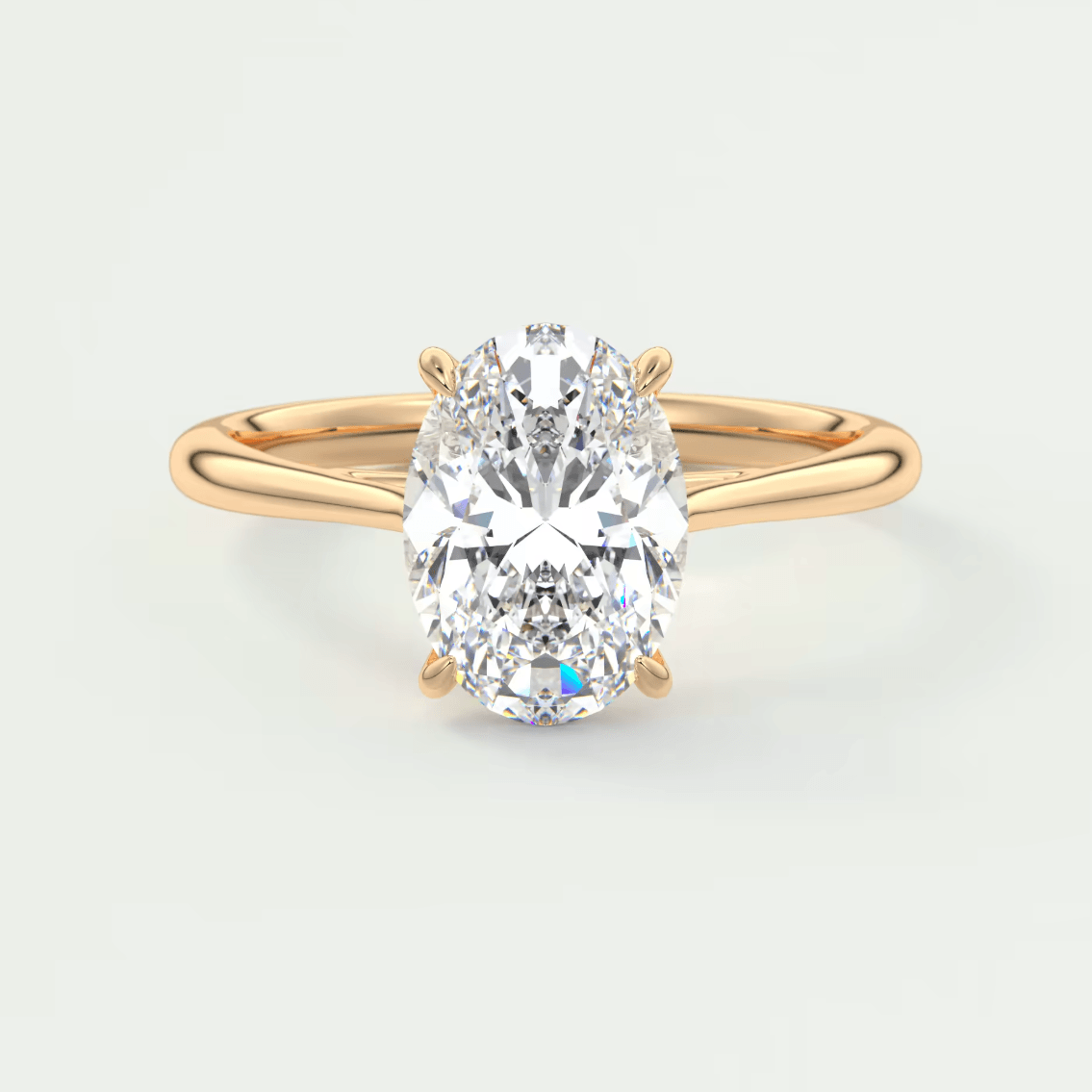 18k rose gold engagement ring with a pear-shaped diamond.