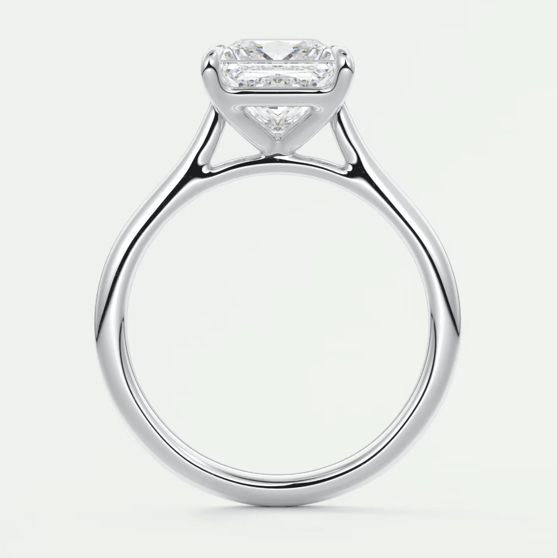 18k white gold princess cut diamond engagement ring with baguette side stones.