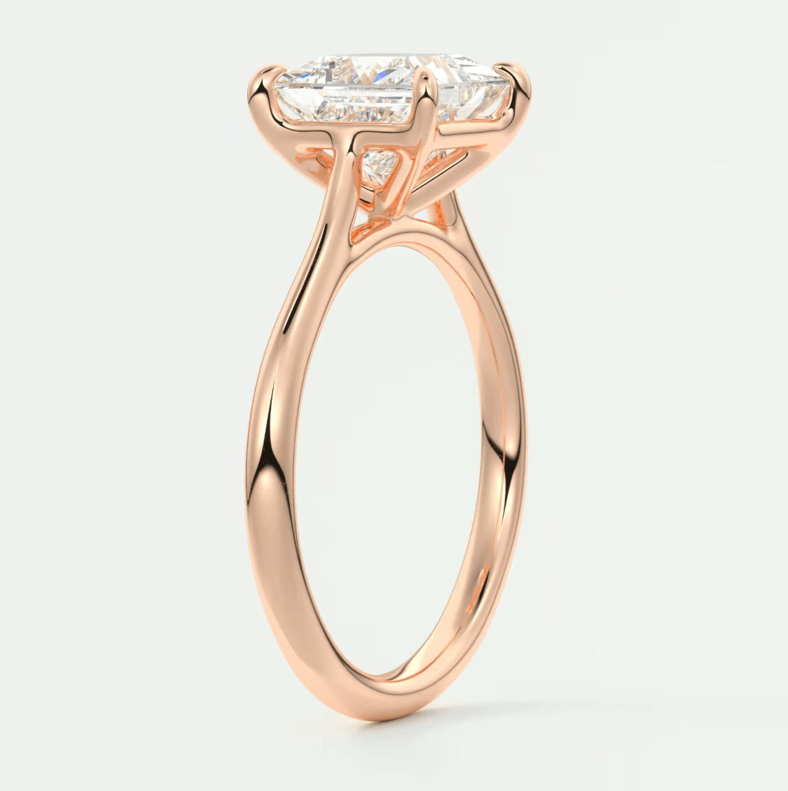 Rose gold engagement ring with a princess cut diamond.