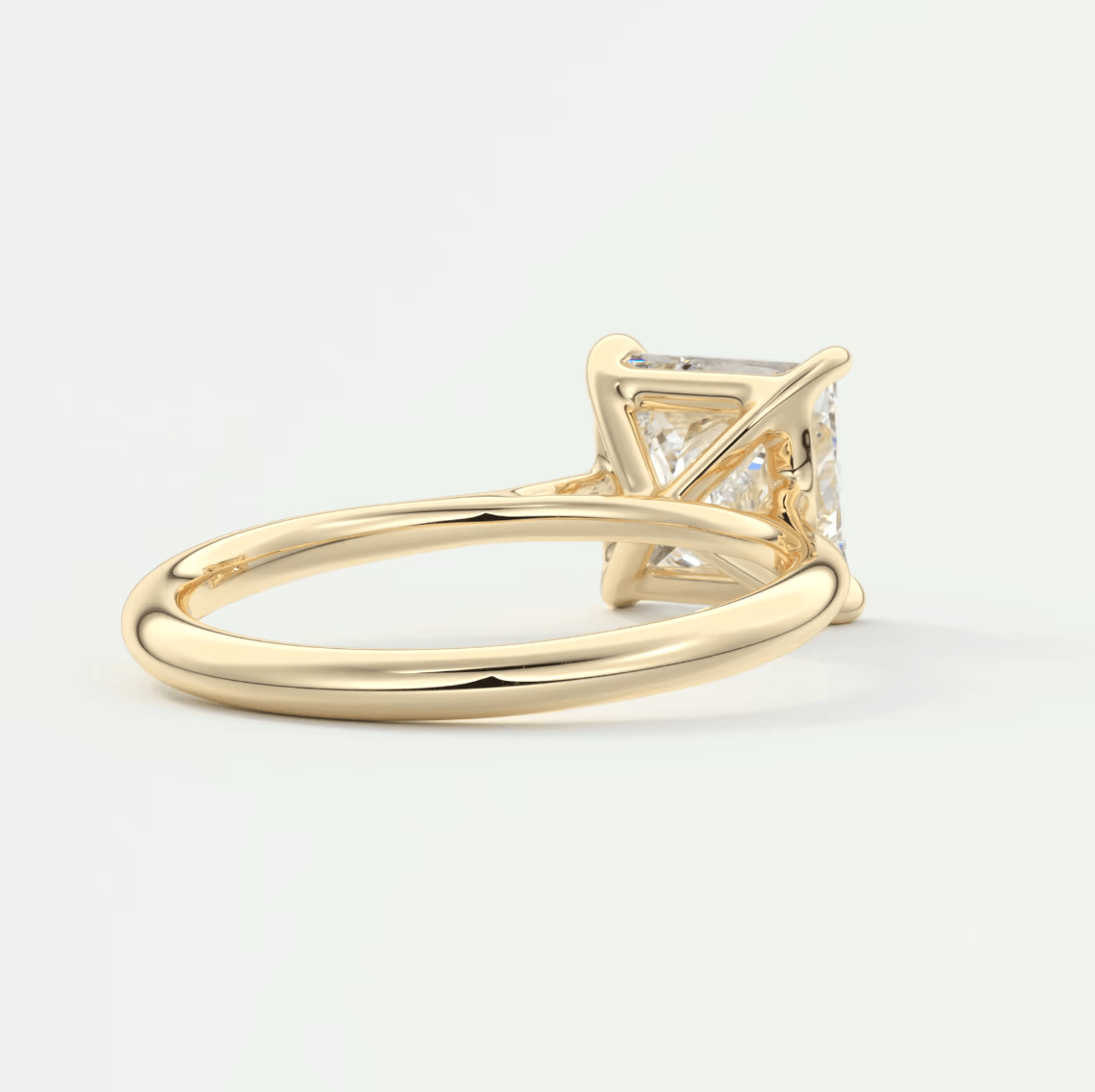 18k yellow gold princess cut diamond engagement ring.