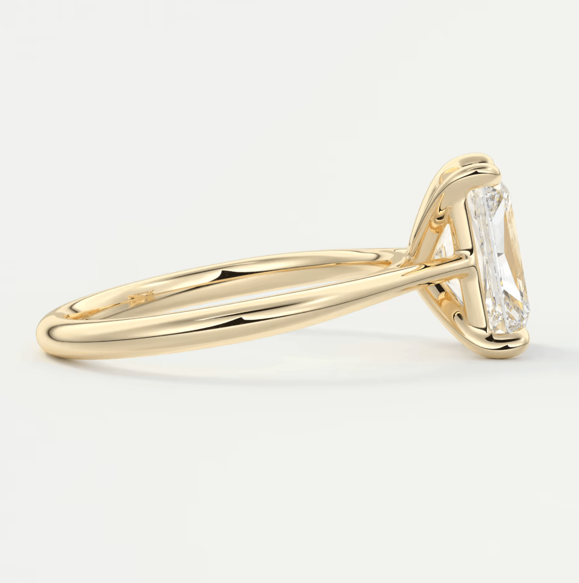18k yellow gold emerald cut diamond engagement ring.