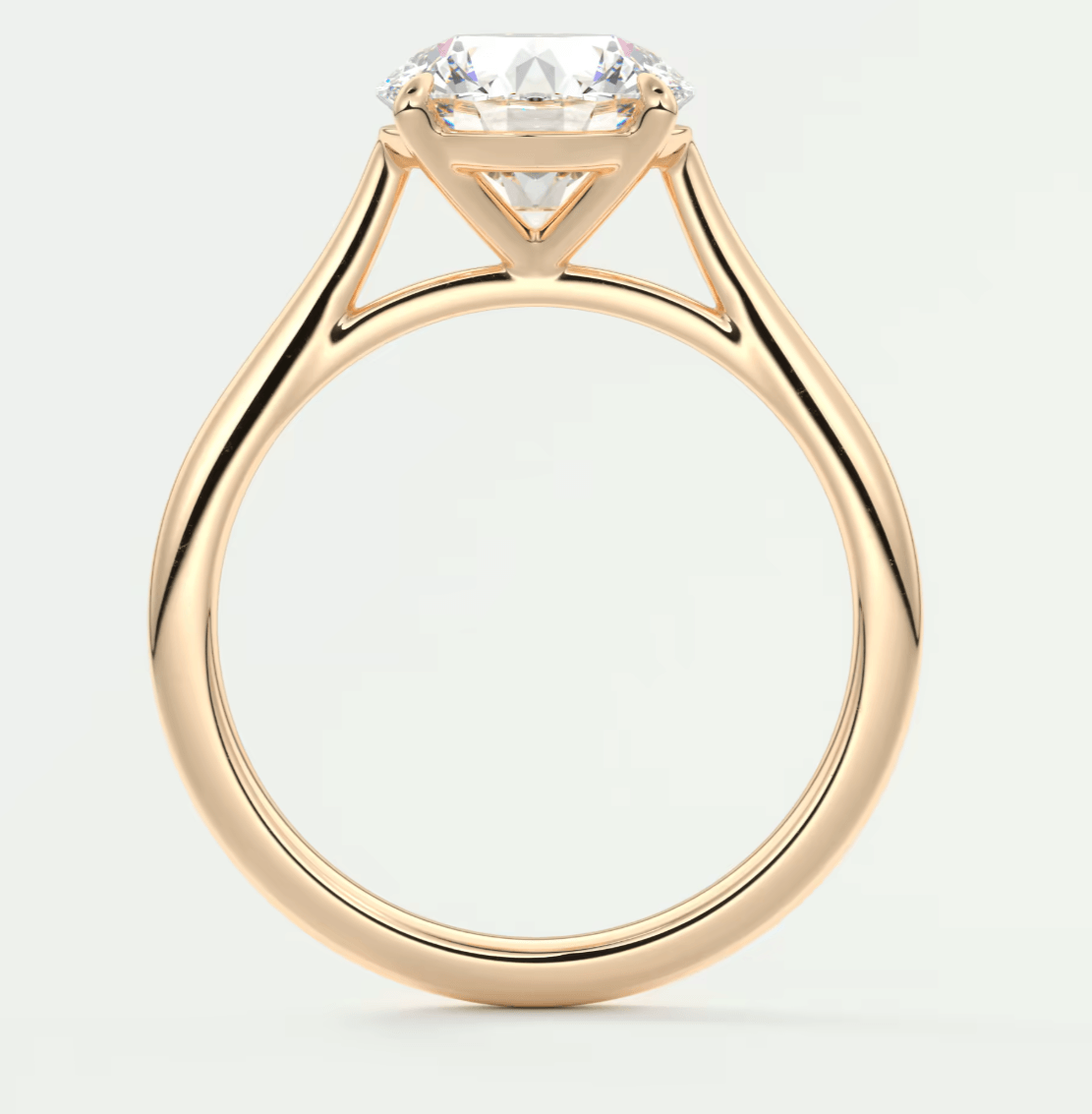 18-karat rose gold engagement ring with a princess-cut diamond.