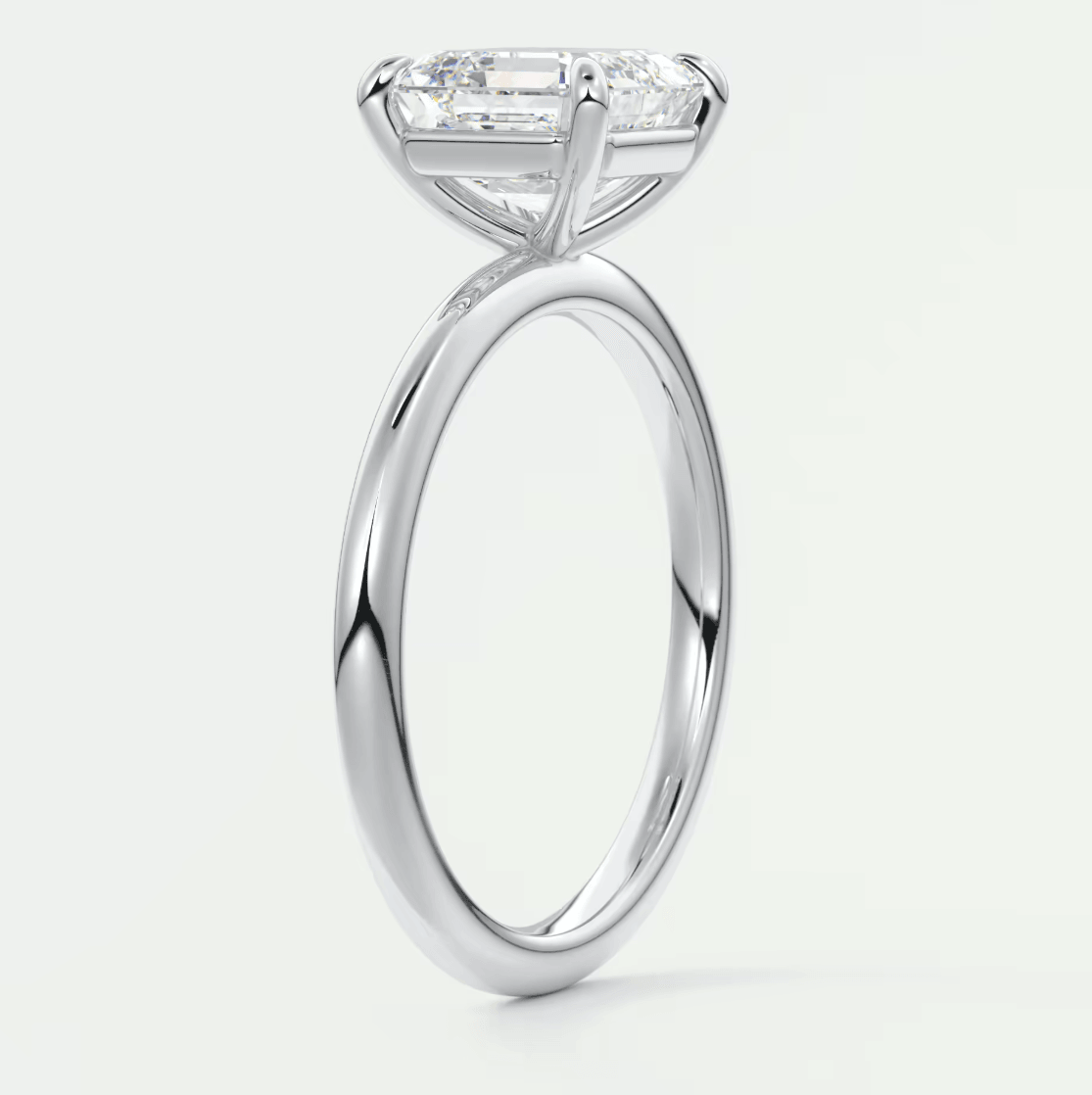 18-karat white gold engagement ring with a princess-cut diamond.