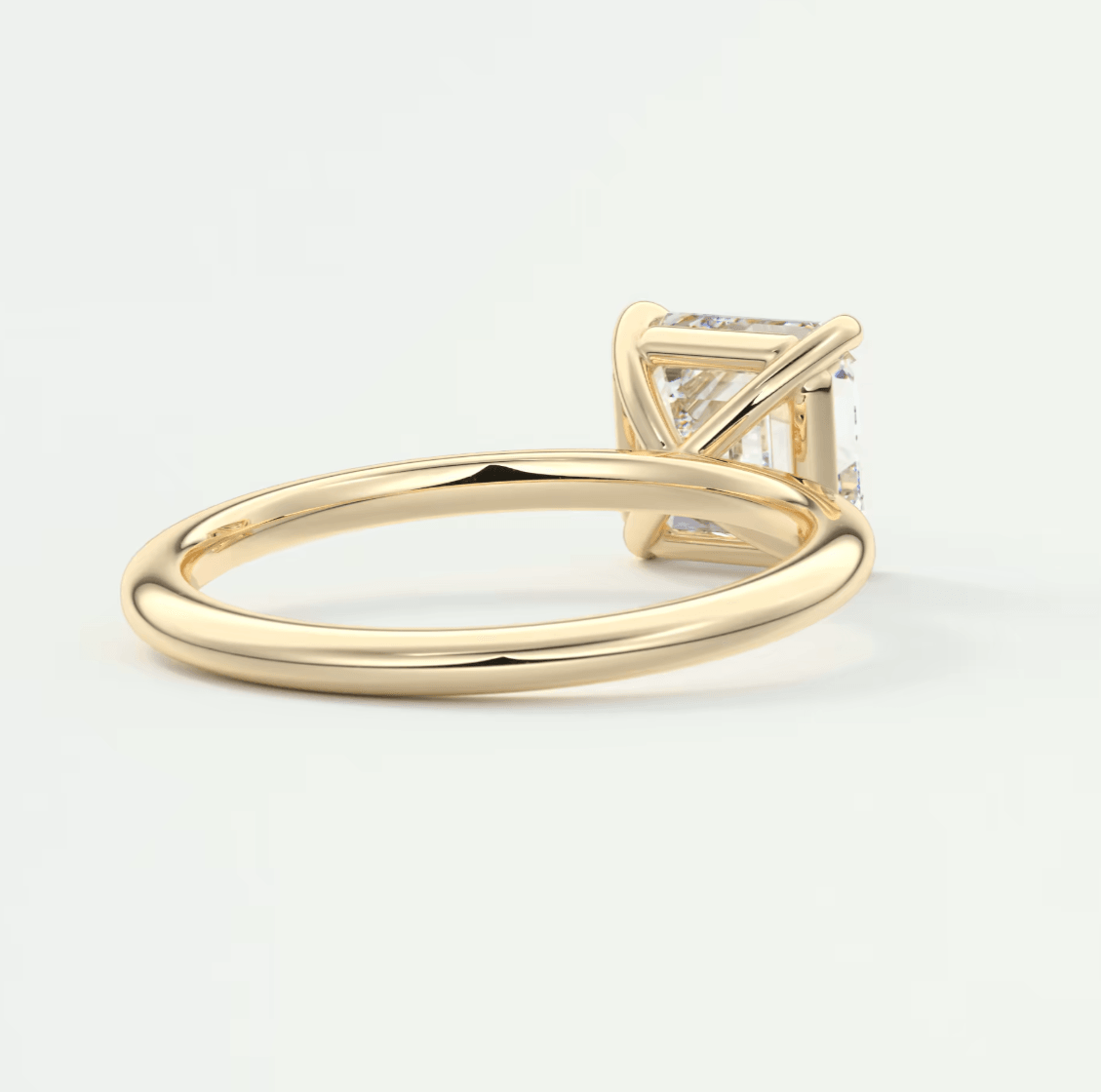 18k yellow gold princess cut diamond engagement ring.