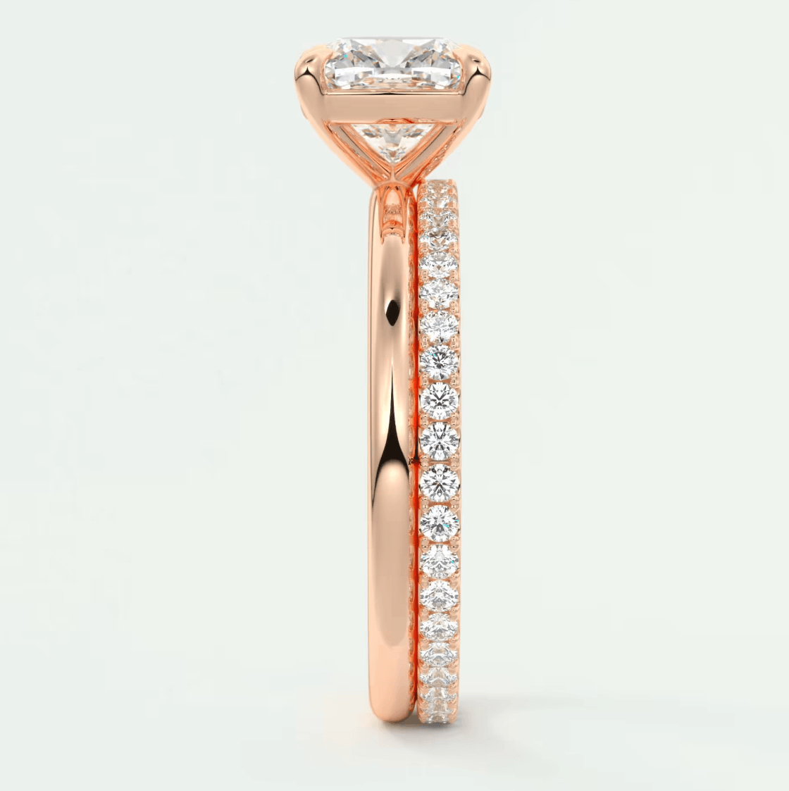 18k rose gold princess cut diamond engagement ring with a pave set band.