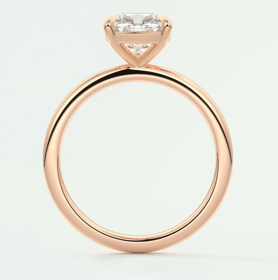 18k rose gold engagement ring with princess cut diamond.