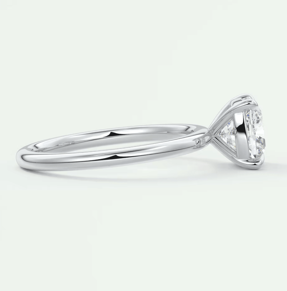 White gold solitaire diamond engagement ring with a classic claw setting.