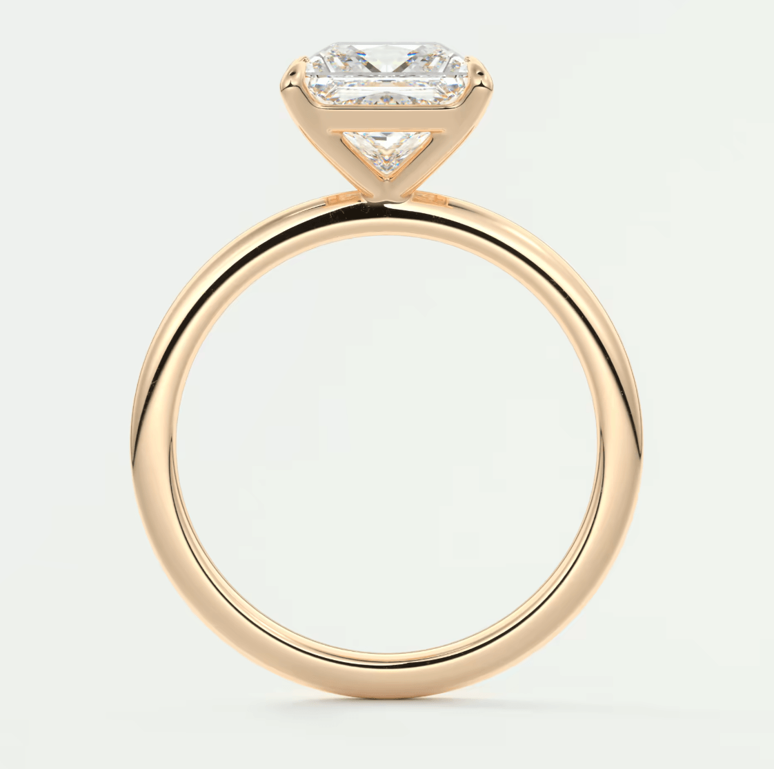 18k yellow gold engagement ring with a princess cut diamond and small side diamonds.