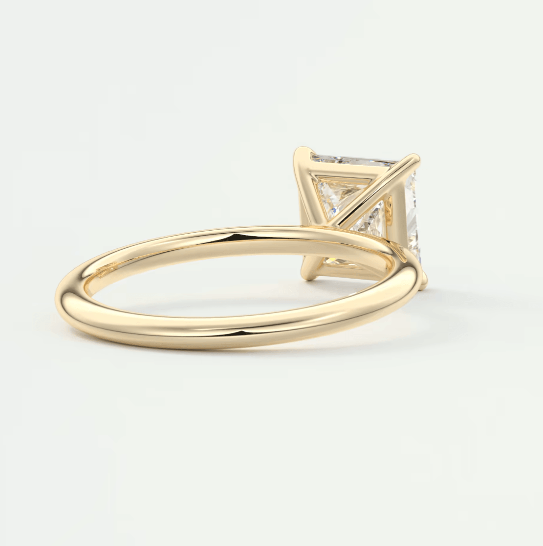 18k yellow gold princess cut diamond engagement ring.