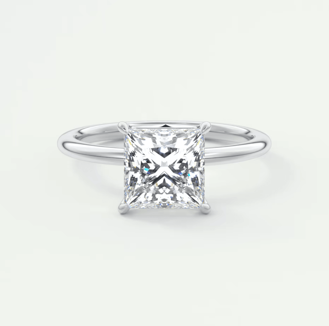 Princess cut diamond engagement ring with white gold band.