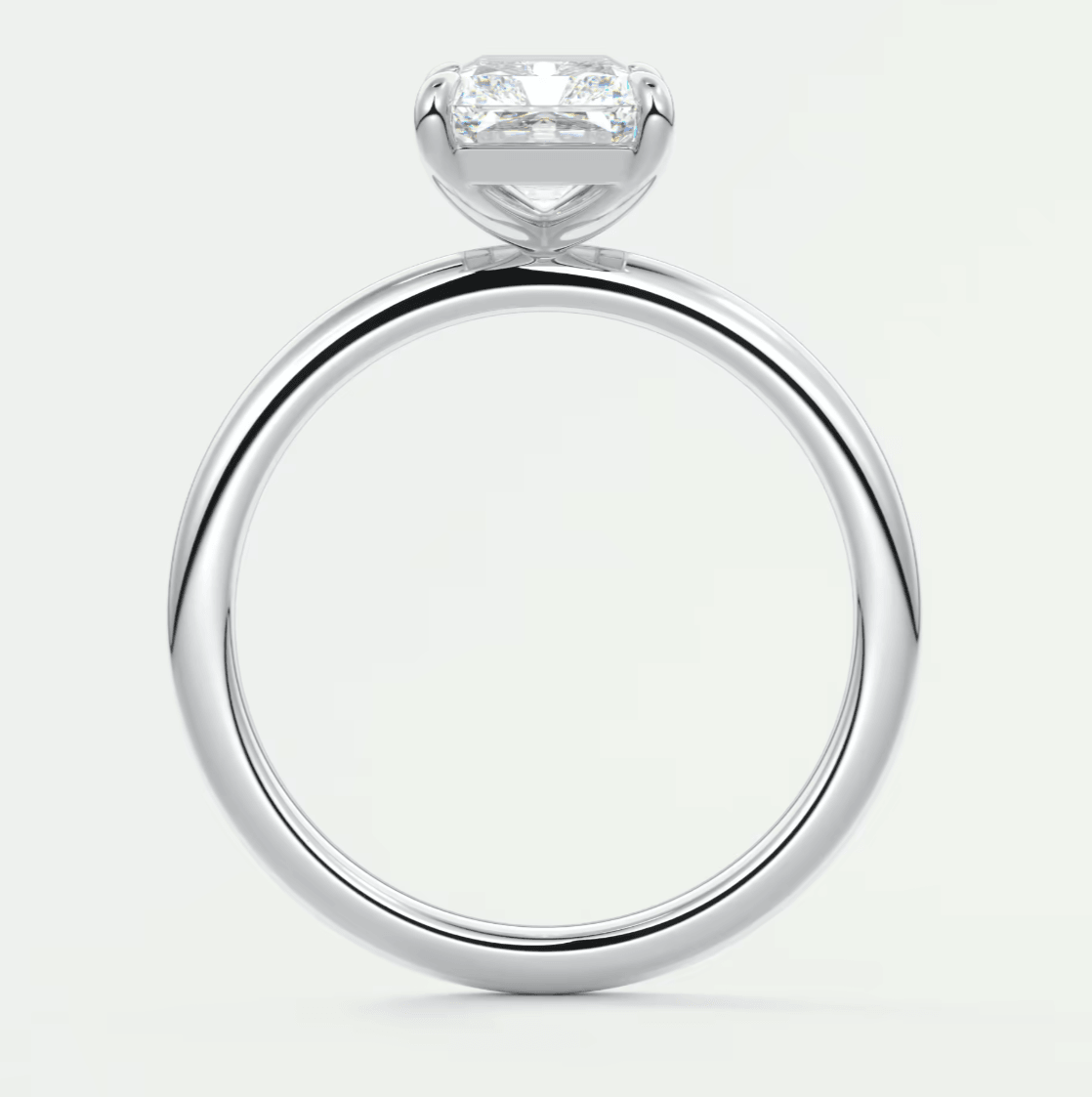 18-karat white gold engagement ring with a princess-cut diamond.
