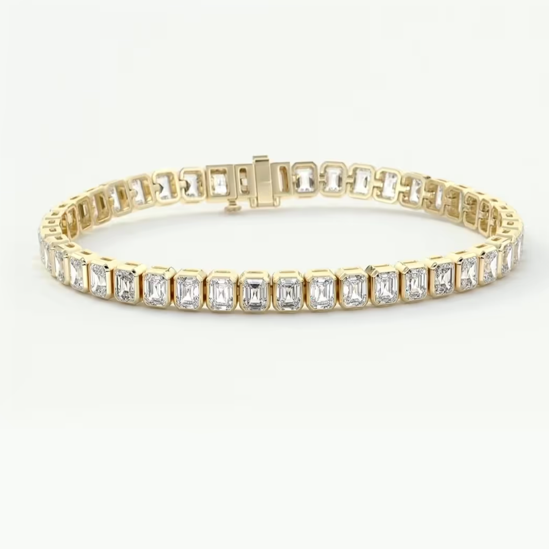 A yellow gold tennis bracelet featuring a continuous row of baguette-cut clear gemstones in a prong setting, displayed on a clean white background.