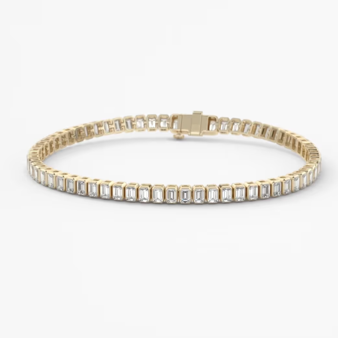 A yellow gold tennis bracelet featuring a row of baguette-cut clear gemstones, displayed on a clean white background.