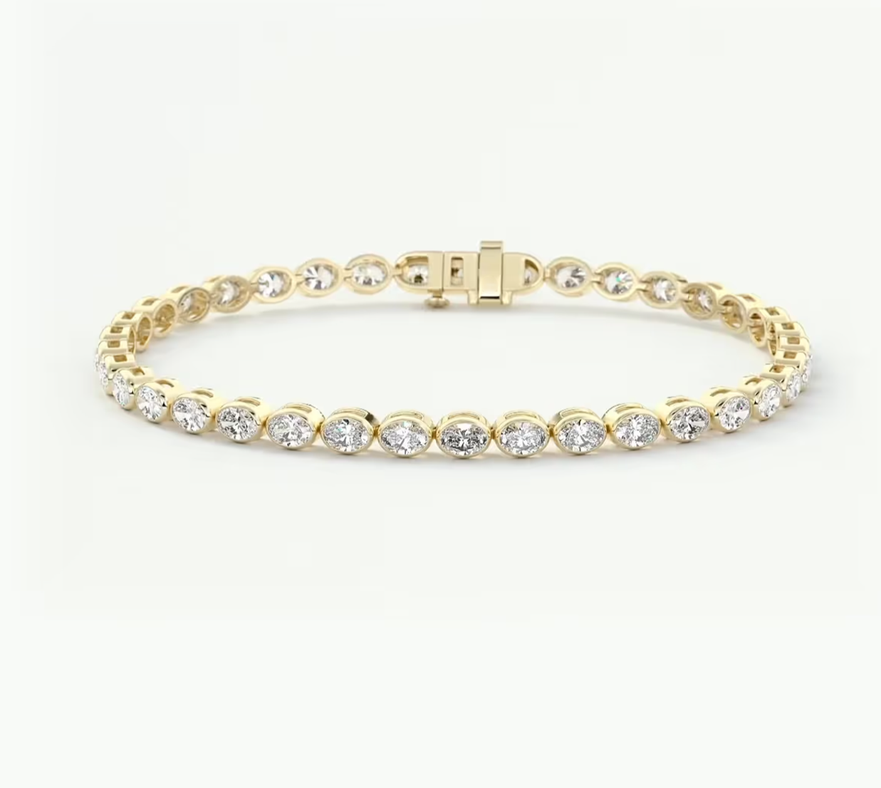 A yellow gold tennis bracelet featuring a continuous row of round-cut clear gemstones in a classic link design, displayed on a clean white background.