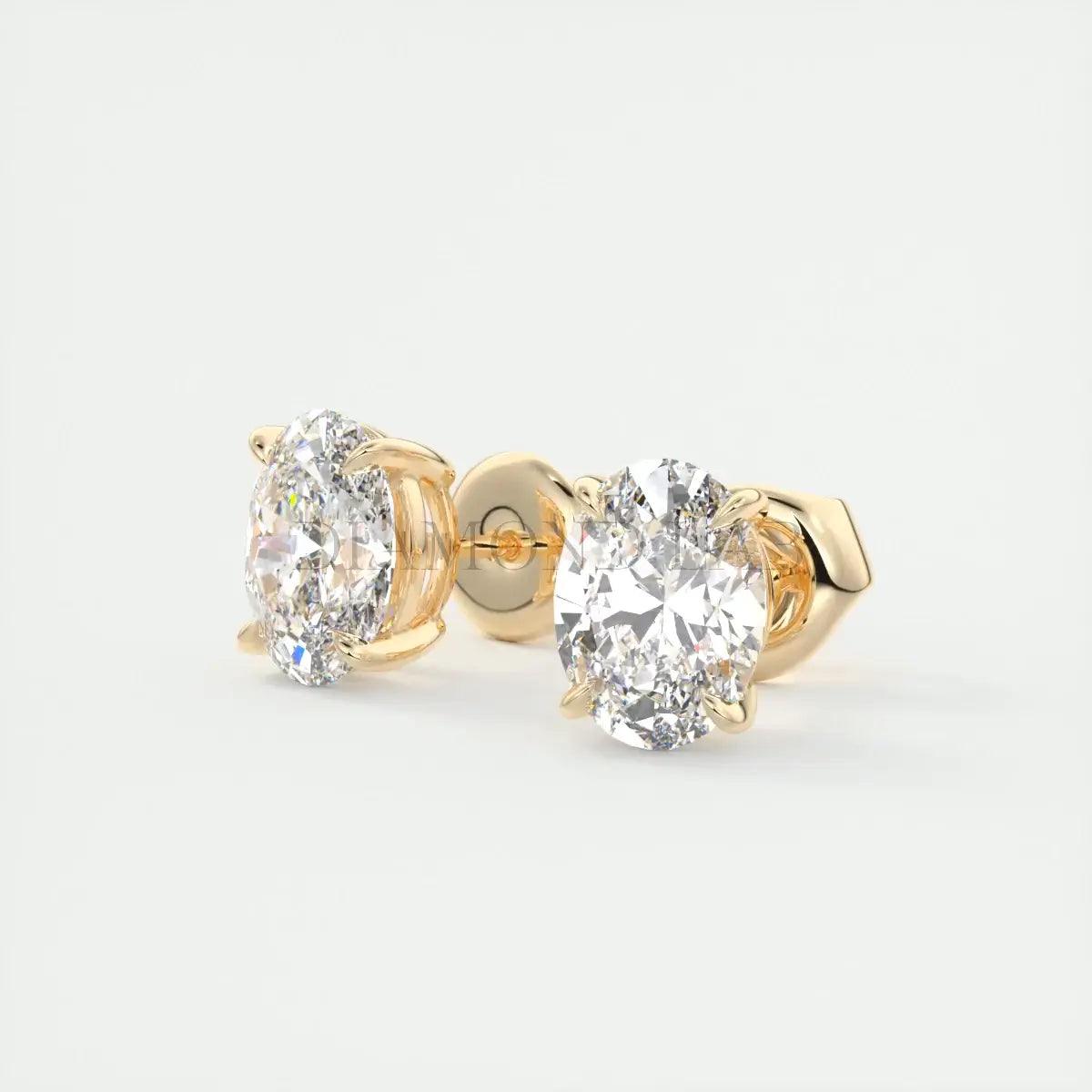 18-karat gold diamond stud earrings with a classic round-cut design.