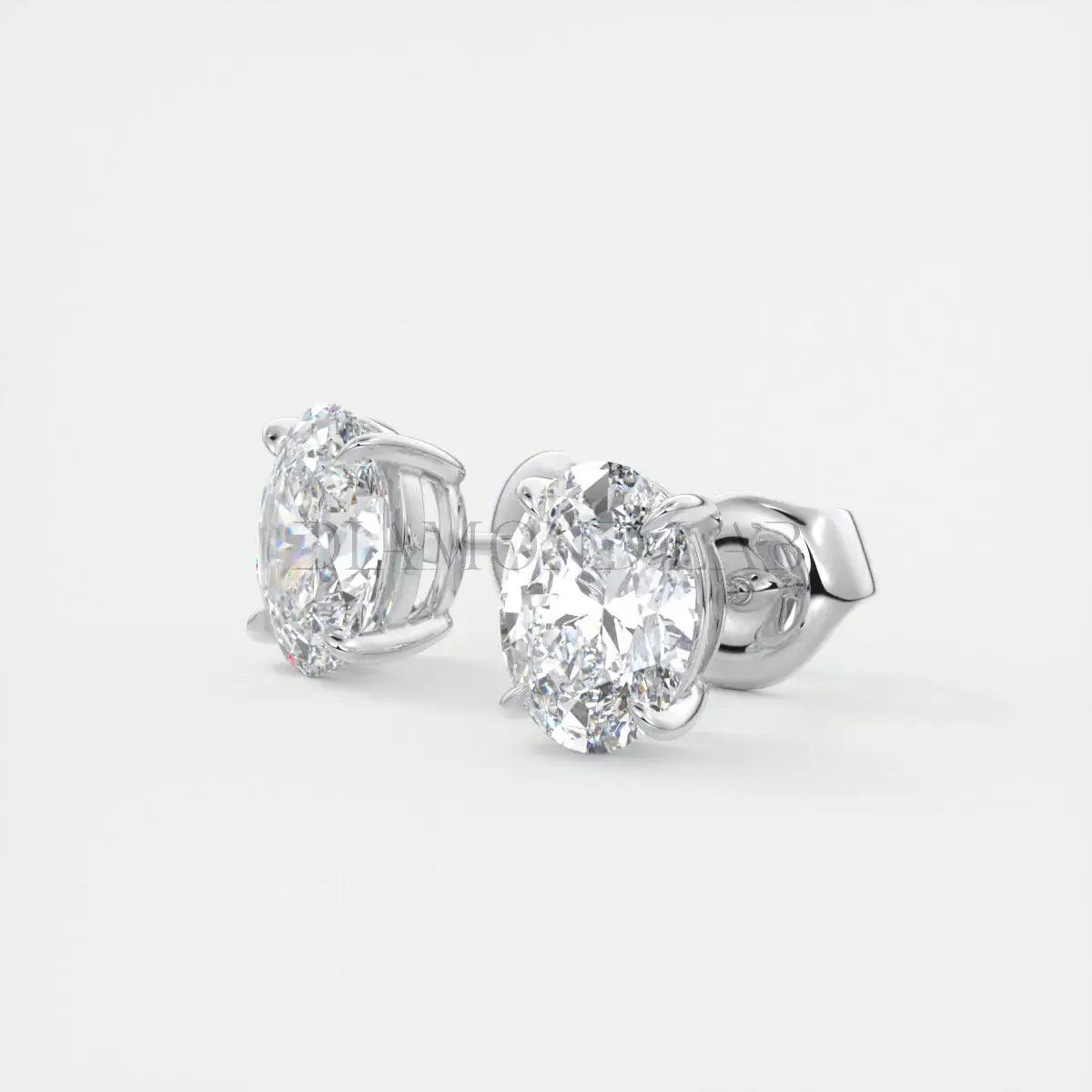 18k white gold oval diamond stud earrings.