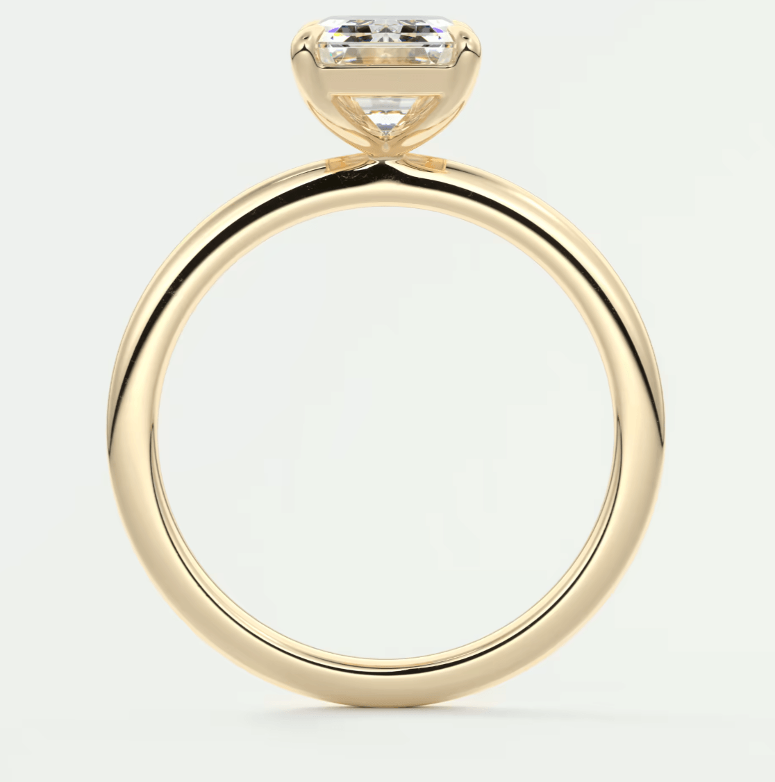 18k yellow gold engagement ring with a princess cut diamond.