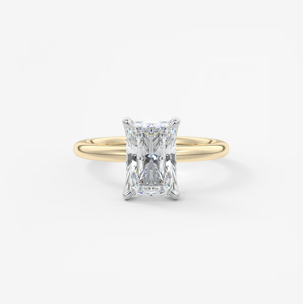 Gold ring with a diamond on a white background