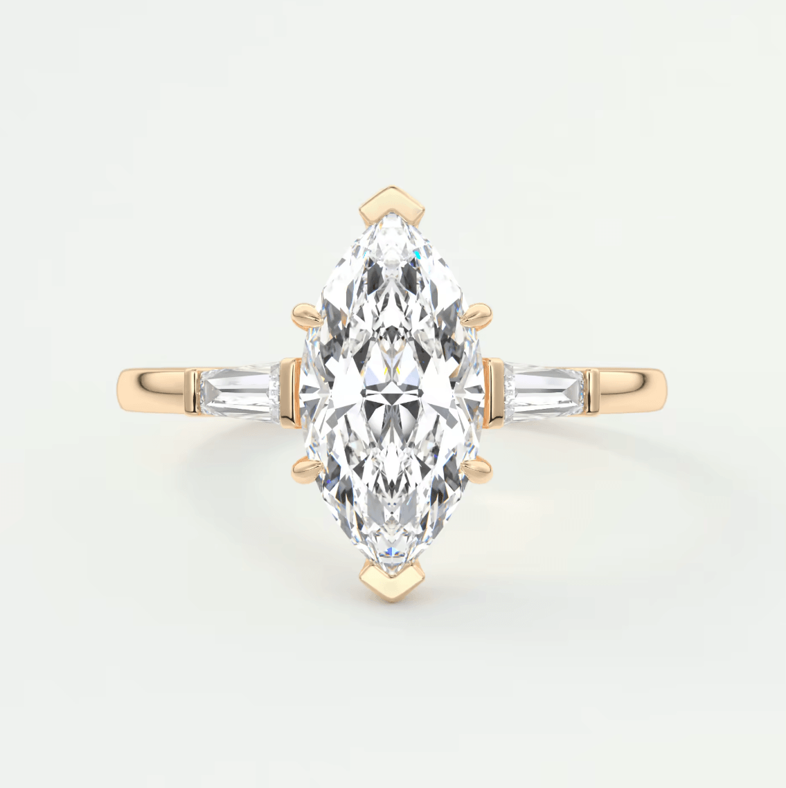 18k yellow gold marquise diamond engagement ring with baguette diamonds.