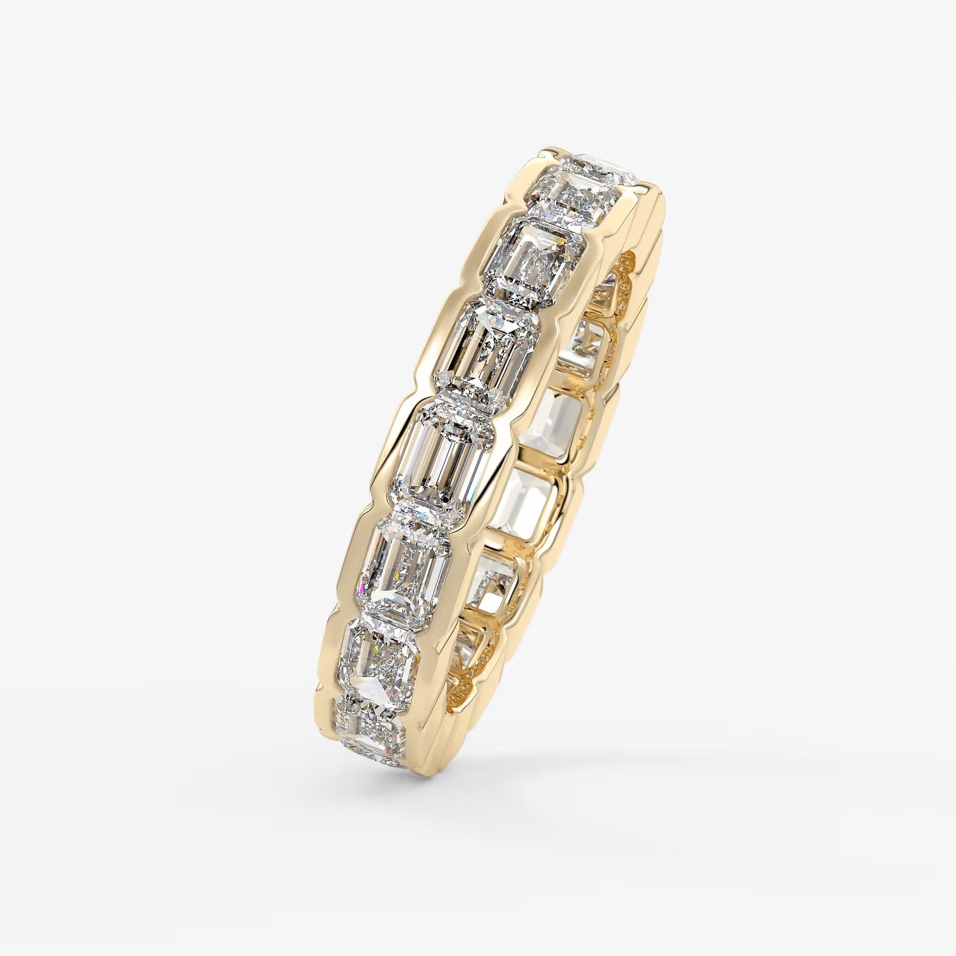 Solara east-west emerald half-bezel eternity band