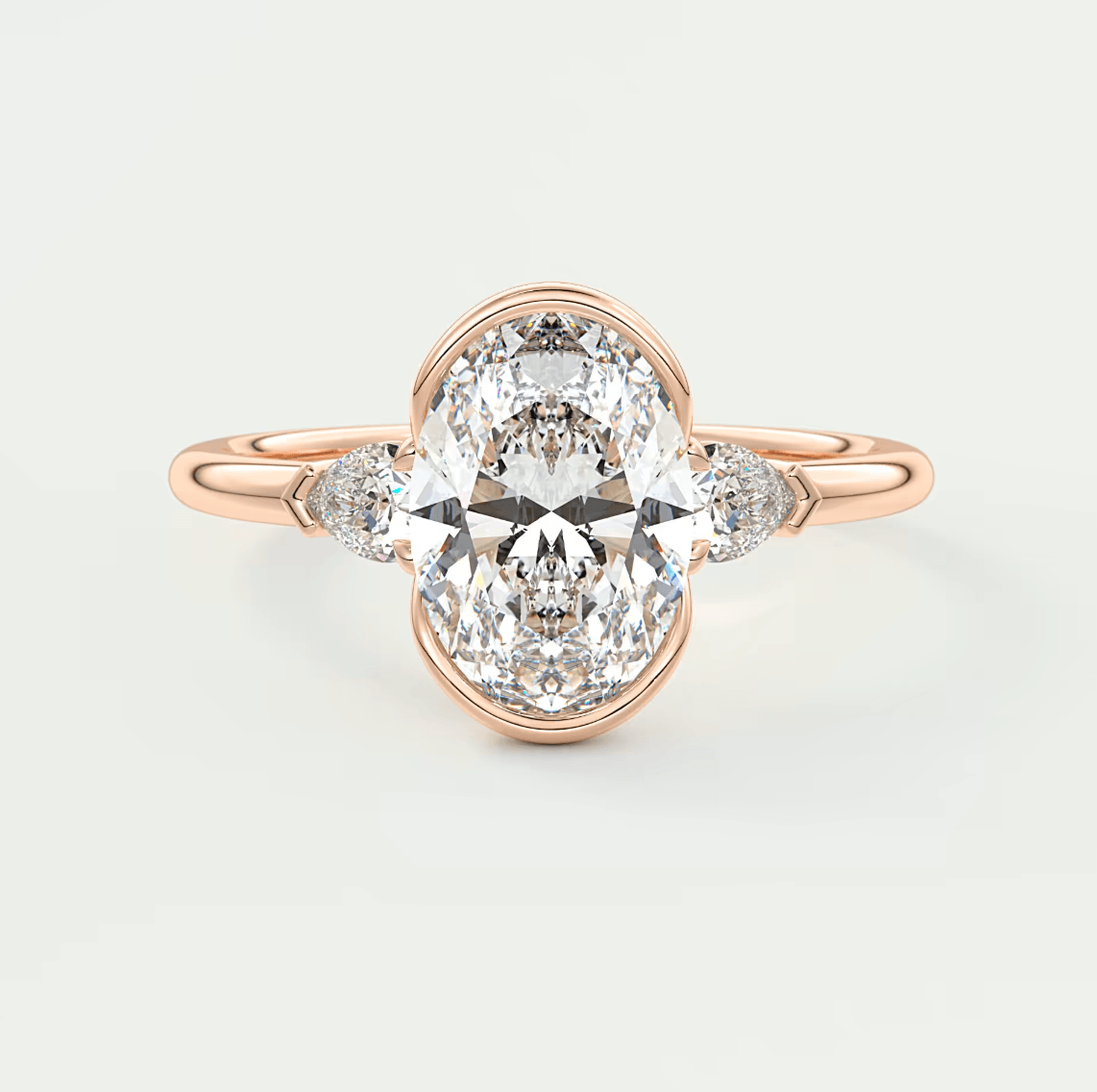 18k rose gold diamond engagement ring with a marquise-cut center stone and small diamonds on the band.