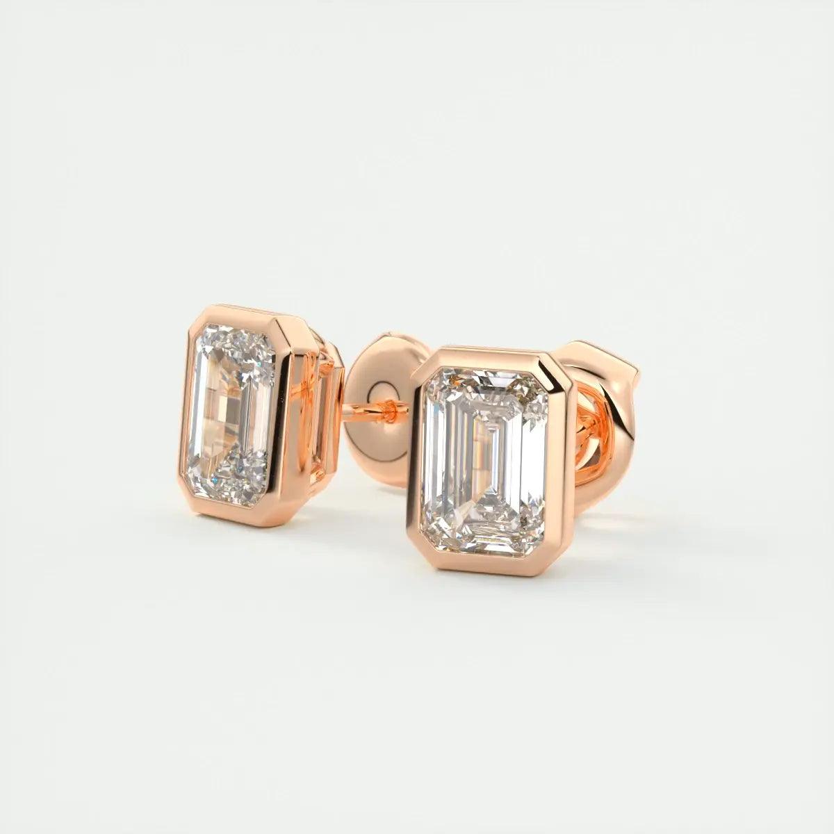 18-karat rose gold diamond stud earrings with emerald-cut gemstones.