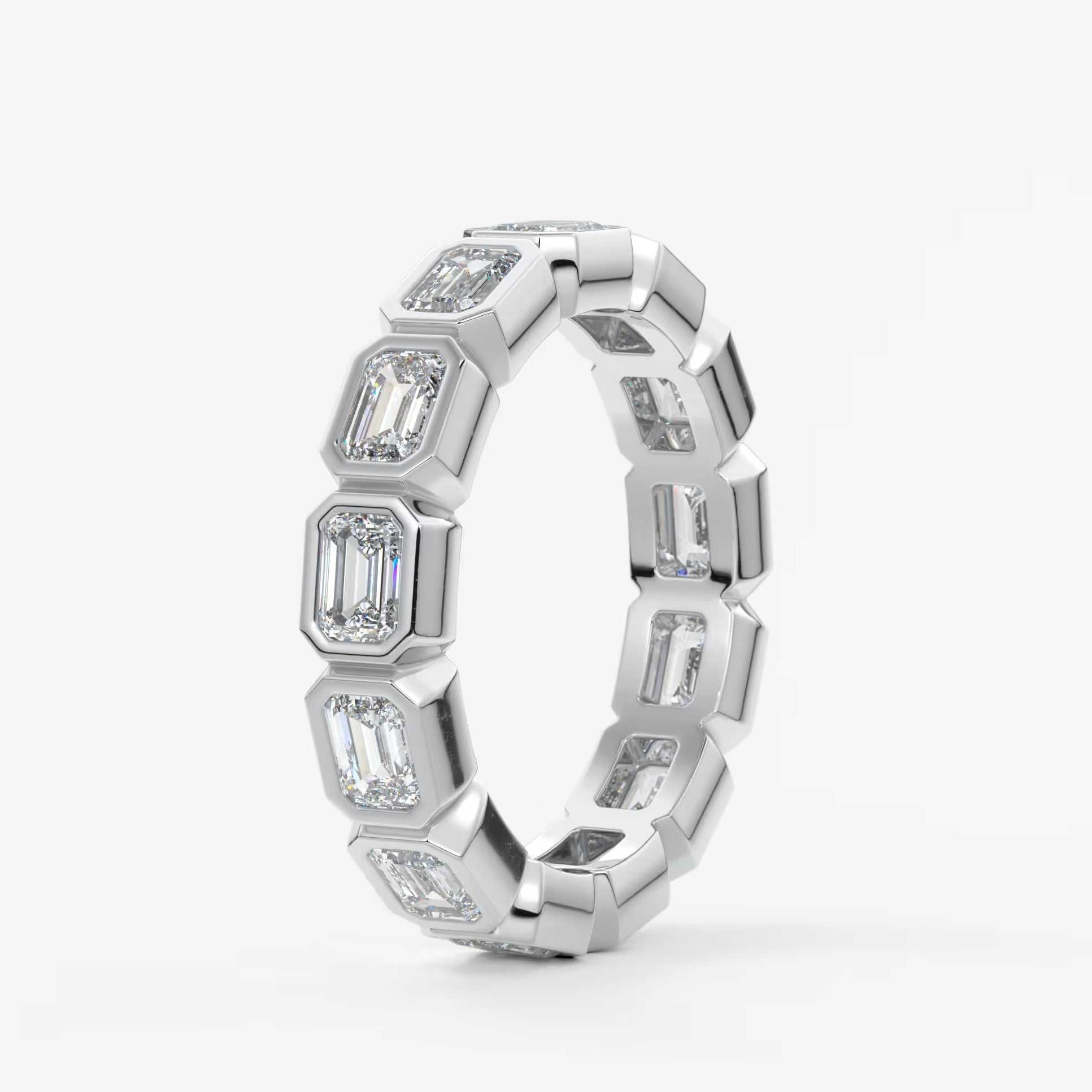 Valora east-west emerald bezel eternity band