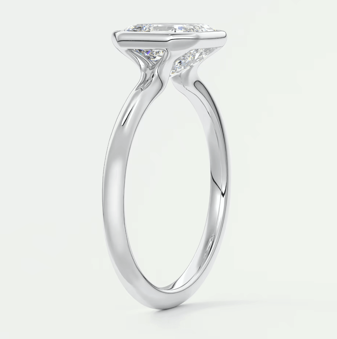 18k white gold engagement ring with a princess cut diamond.