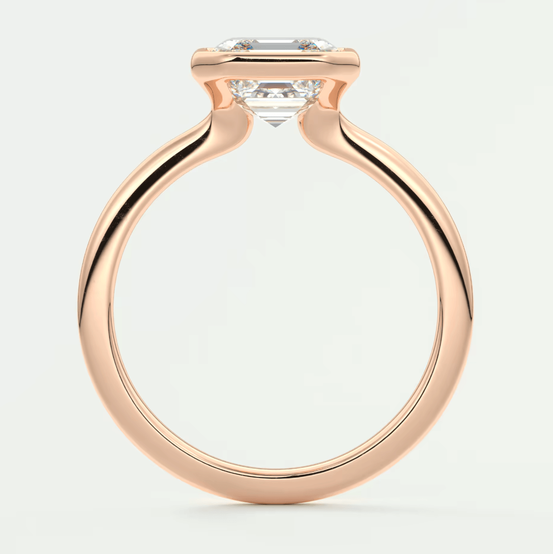 18-karat rose gold engagement ring with a cushion-cut diamond.