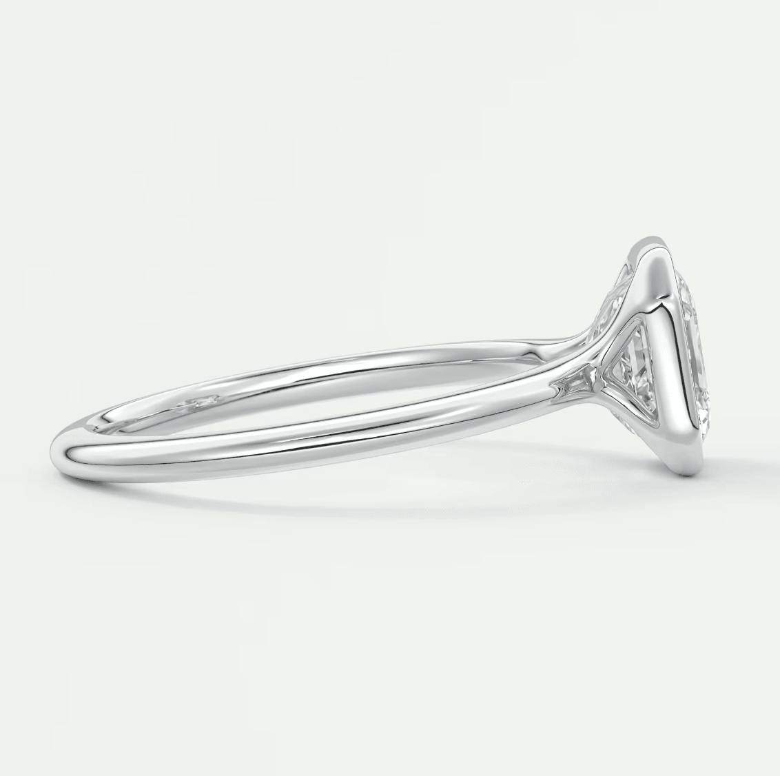 18k white gold diamond engagement ring with a marquise-cut center stone and delicate band.