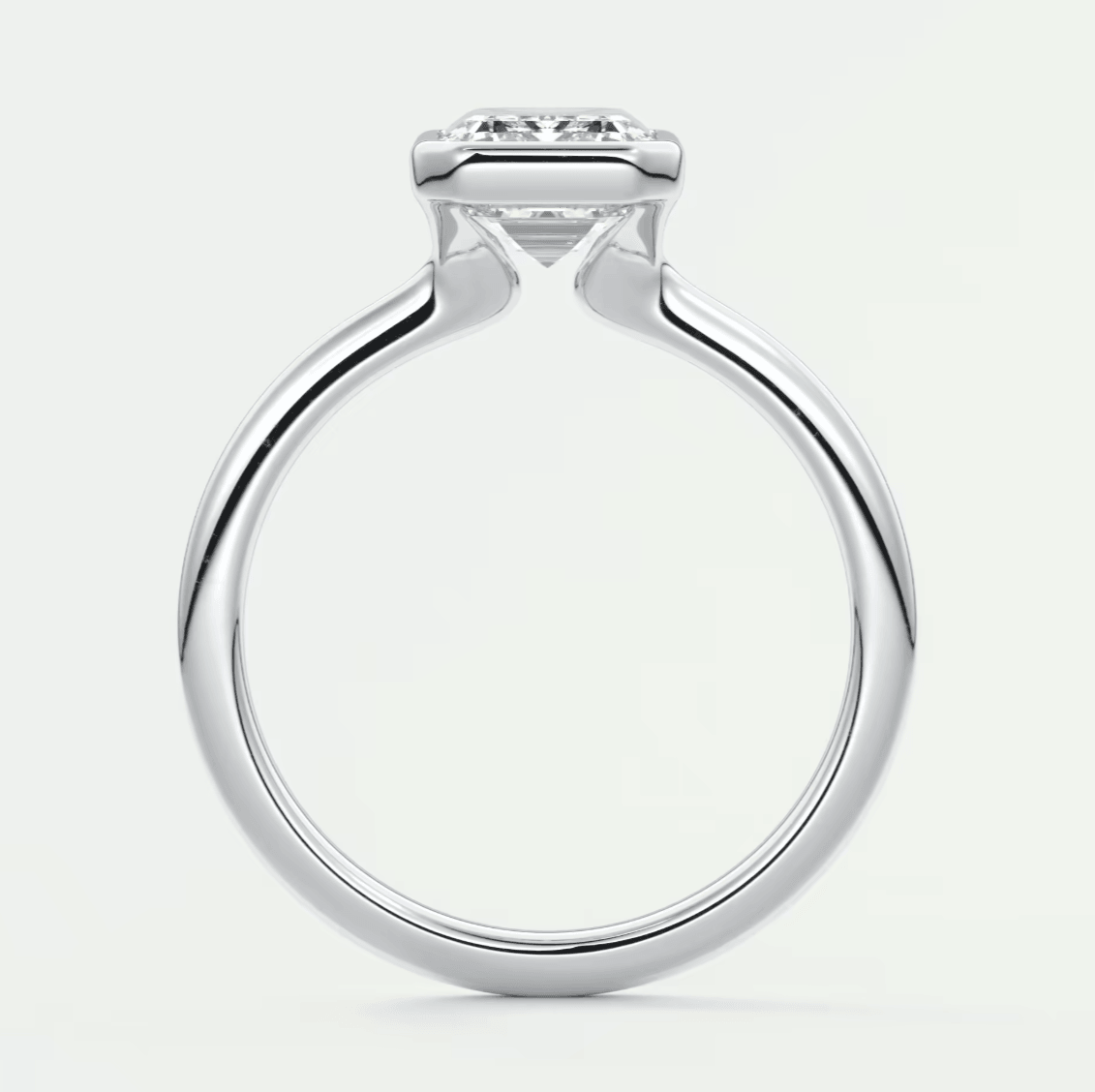 18-karat white gold engagement ring with a princess-cut diamond.