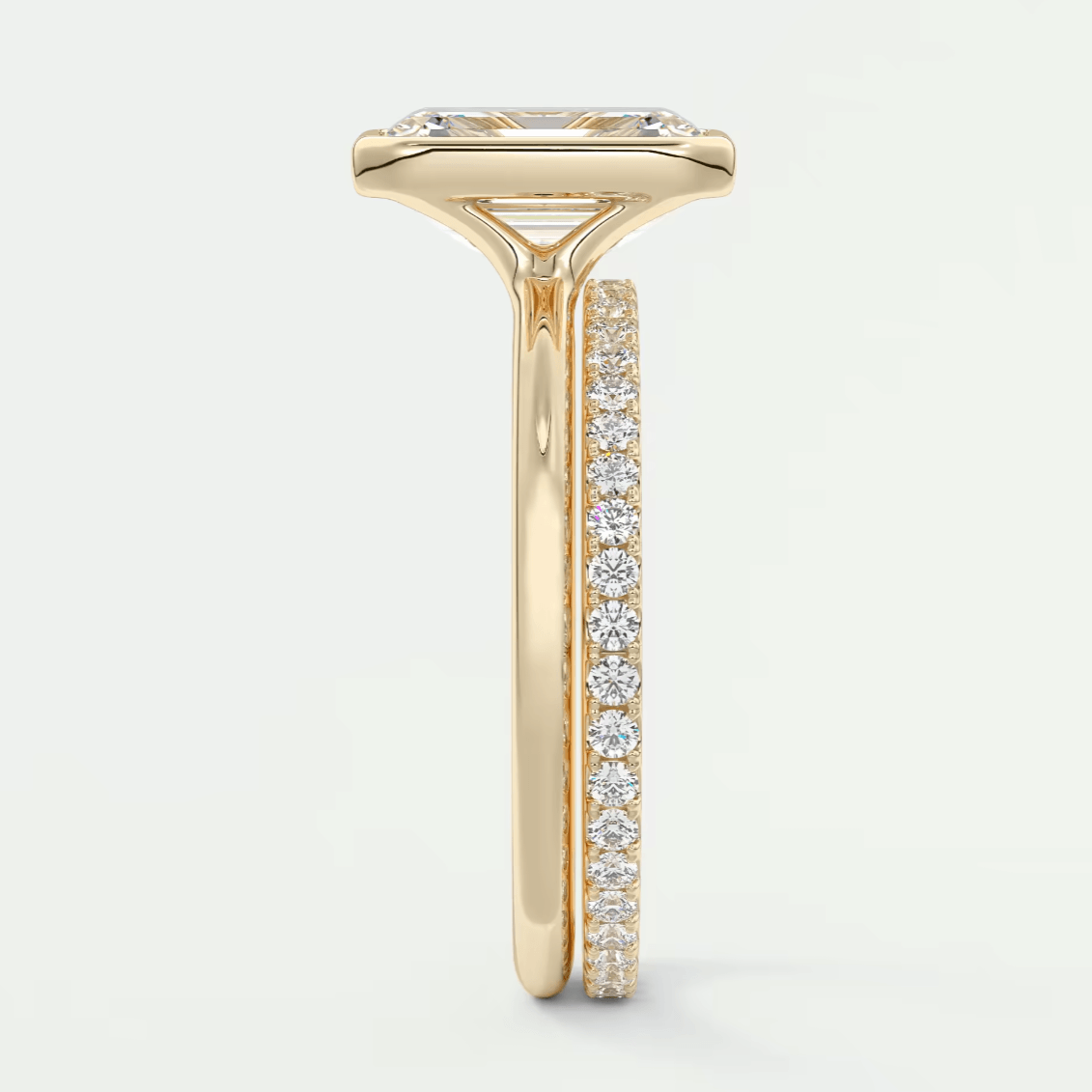 18k yellow gold diamond engagement ring with a marquise-cut center stone and pave set diamonds on the band.