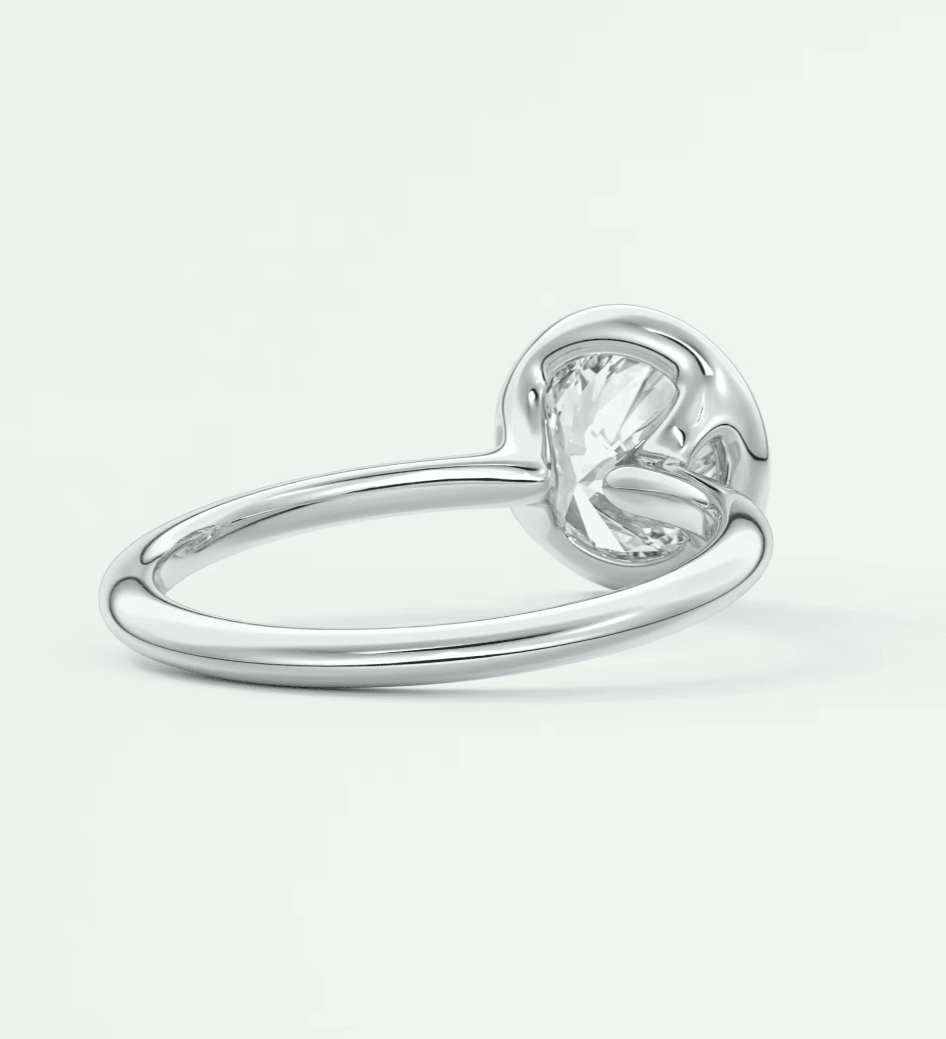 Silver heart-shaped ring with a clear gemstone