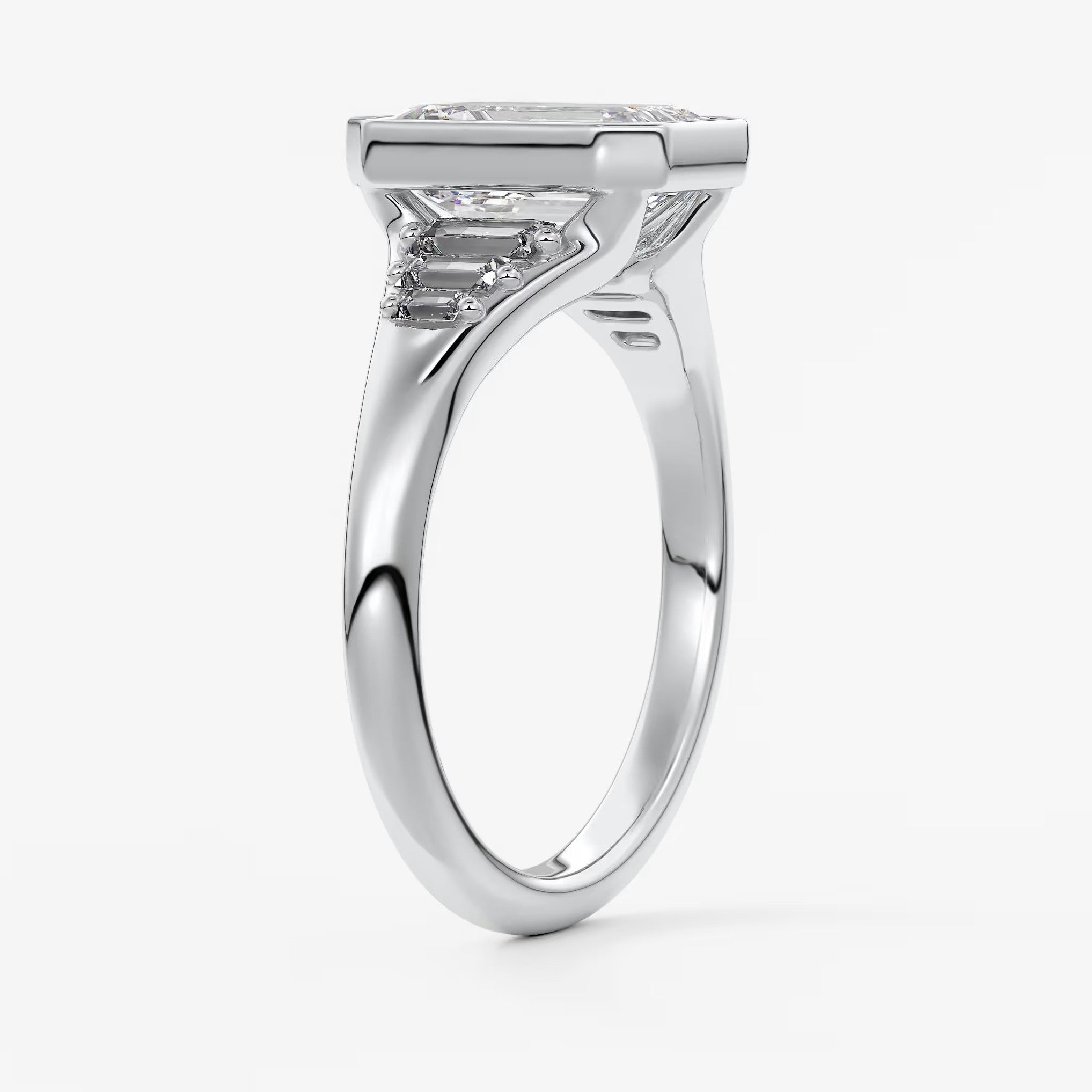 Véda emerald heirloom – seven-stone graduated baguette ring