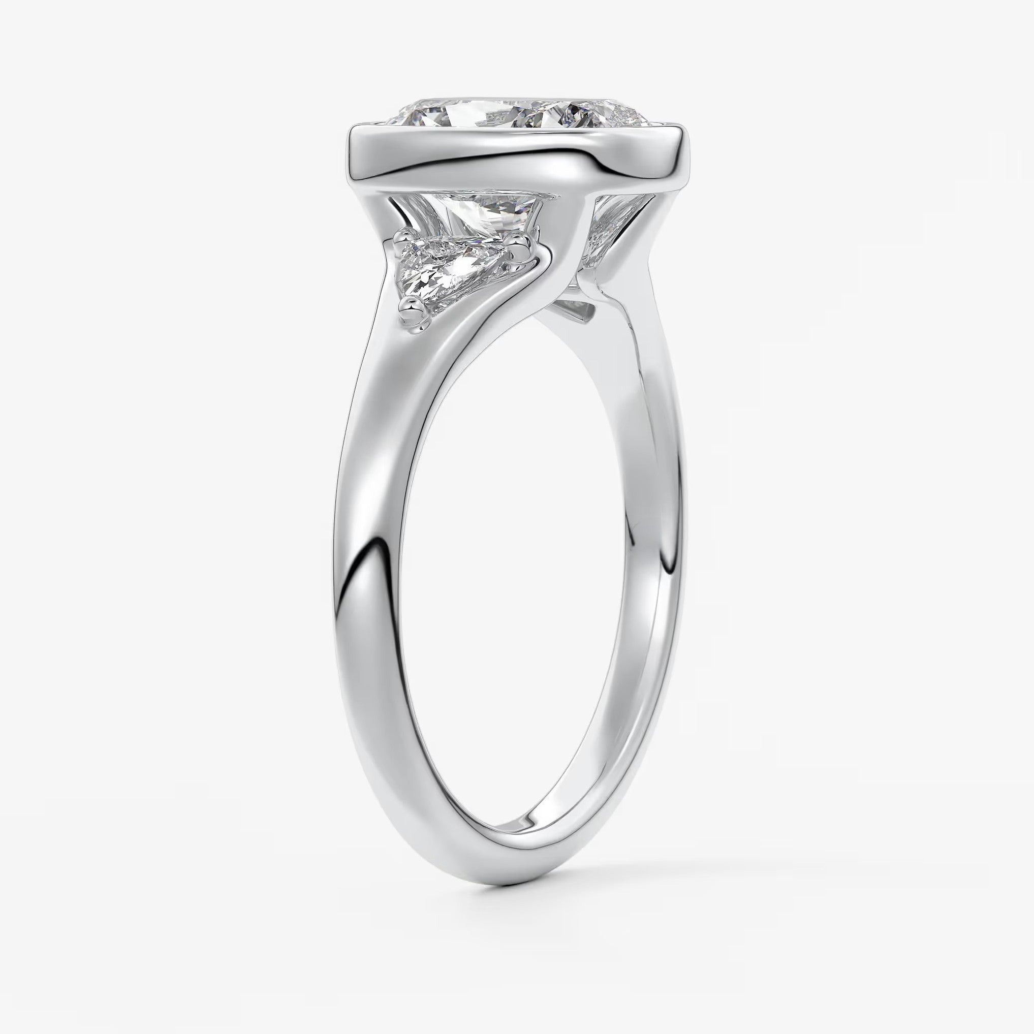 Véda trilogy – cushion with trillion side stone split shank engagement ring