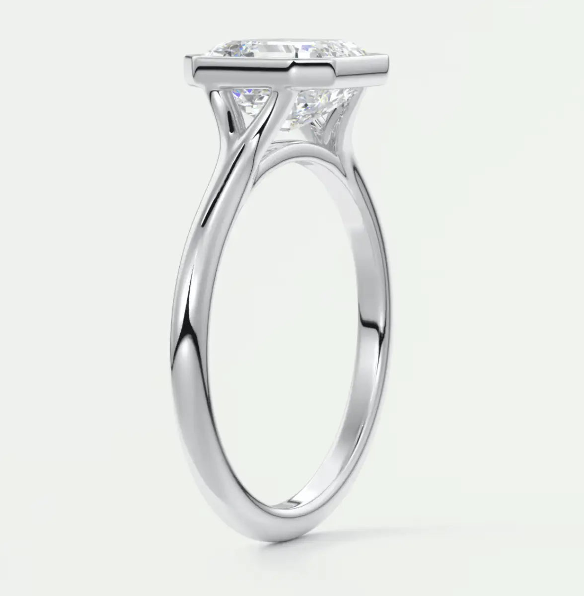 18k white gold princess cut diamond engagement ring with a solitaire design.