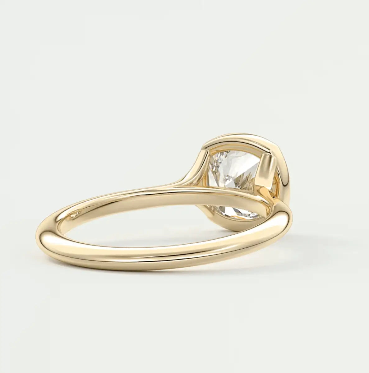 18-karat gold engagement ring with a solitaire diamond.