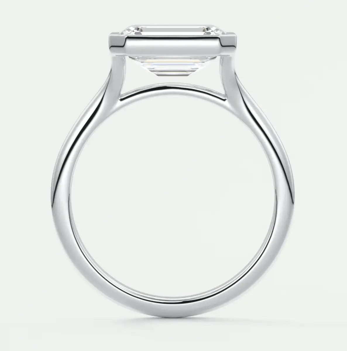 White gold engagement ring with a square-cut diamond.