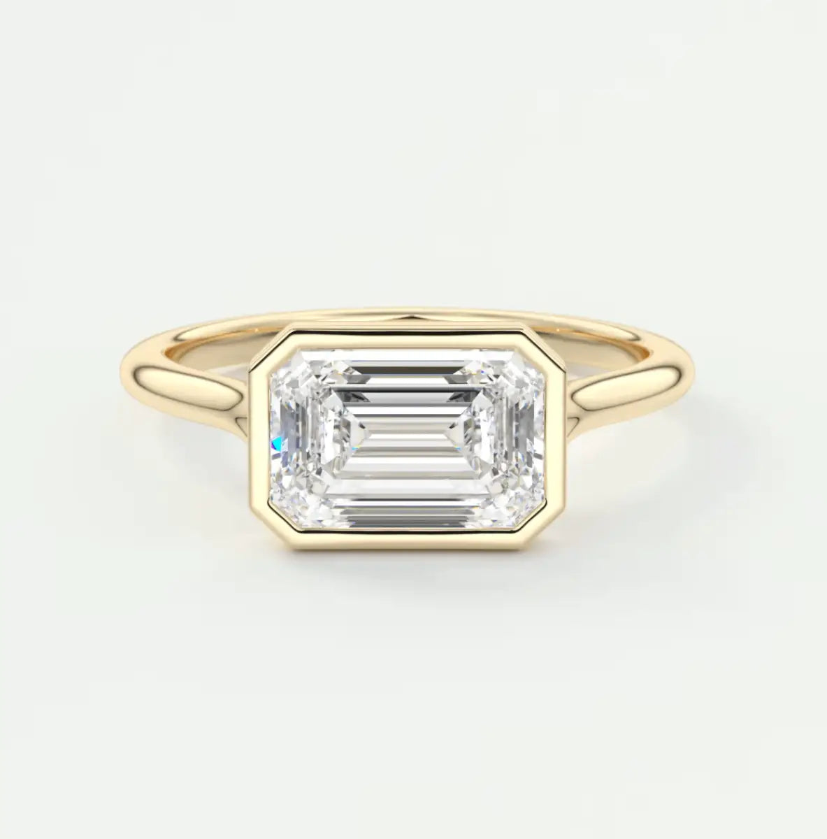 18k yellow gold emerald cut diamond engagement ring.