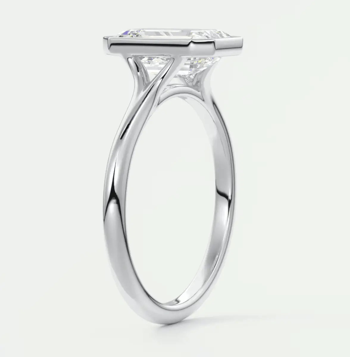Princess cut diamond engagement ring with white gold band, featuring a cushion-shaped stone.