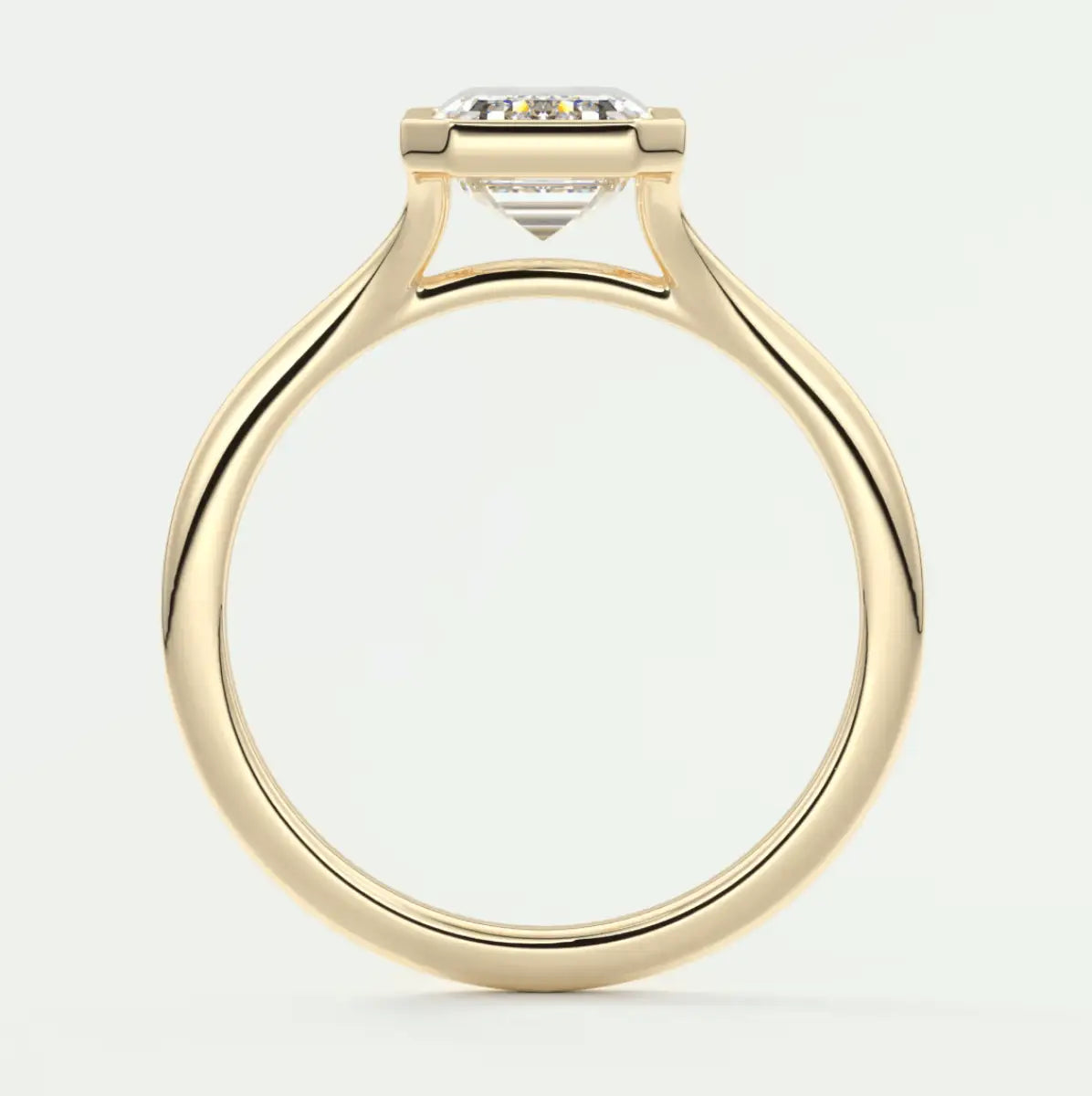 18-karat yellow gold engagement ring with a princess-cut diamond.