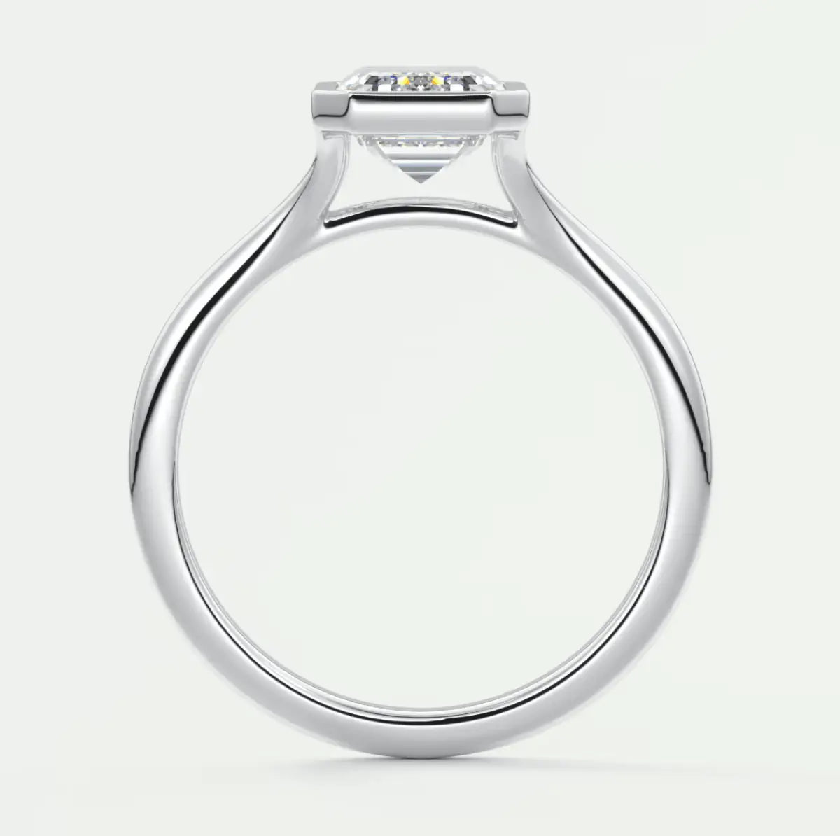 White gold diamond engagement ring with a solitaire design and side stones.