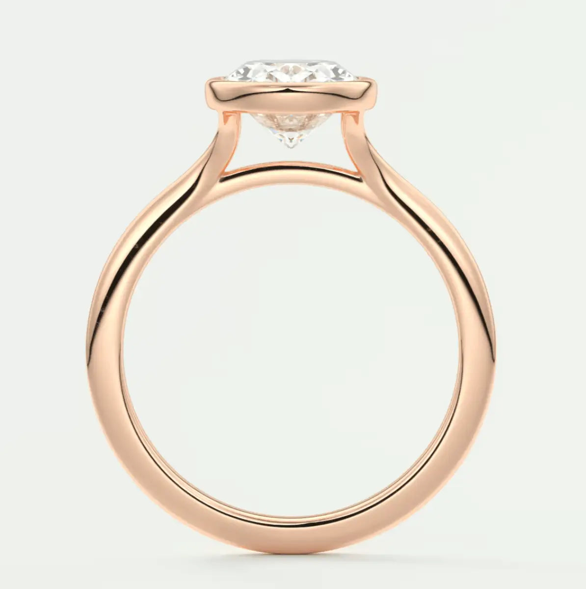 18k rose gold engagement ring with a round diamond center stone.
