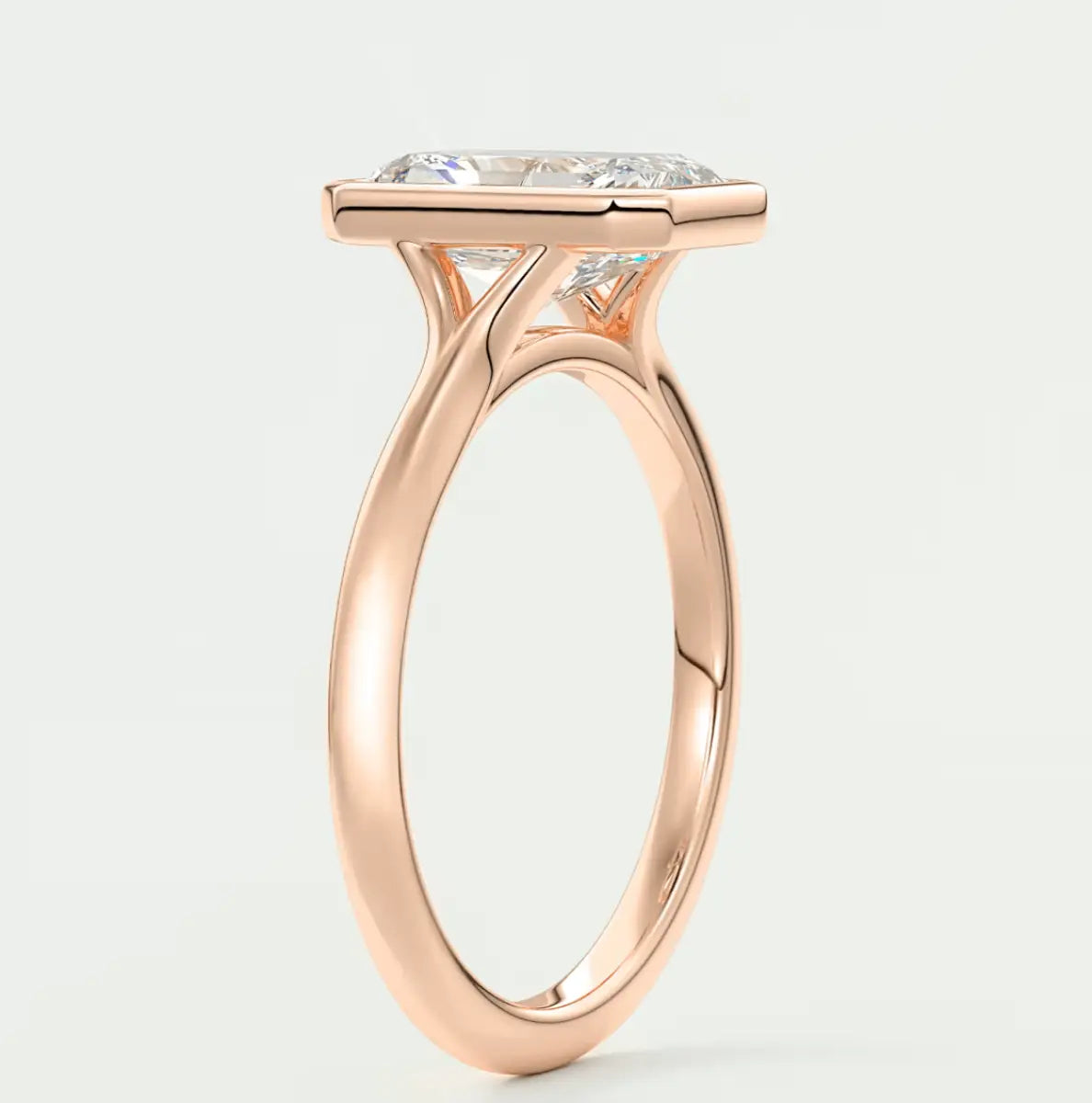 18k rose gold cushion-cut diamond engagement ring with a classic solitaire design.