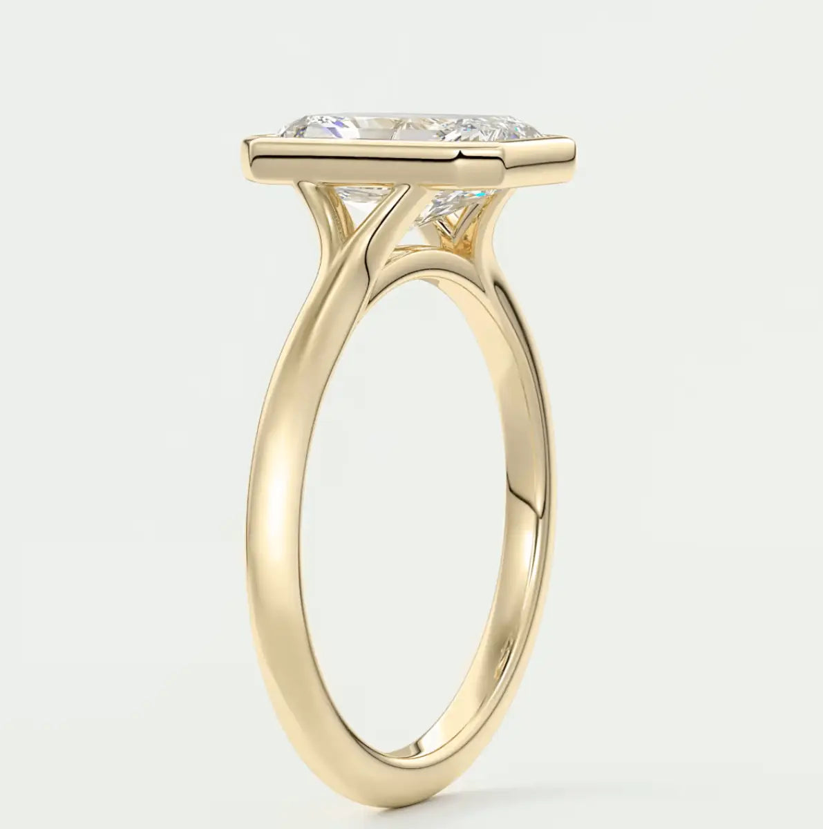 18k yellow gold engagement ring with a cushion-cut diamond.