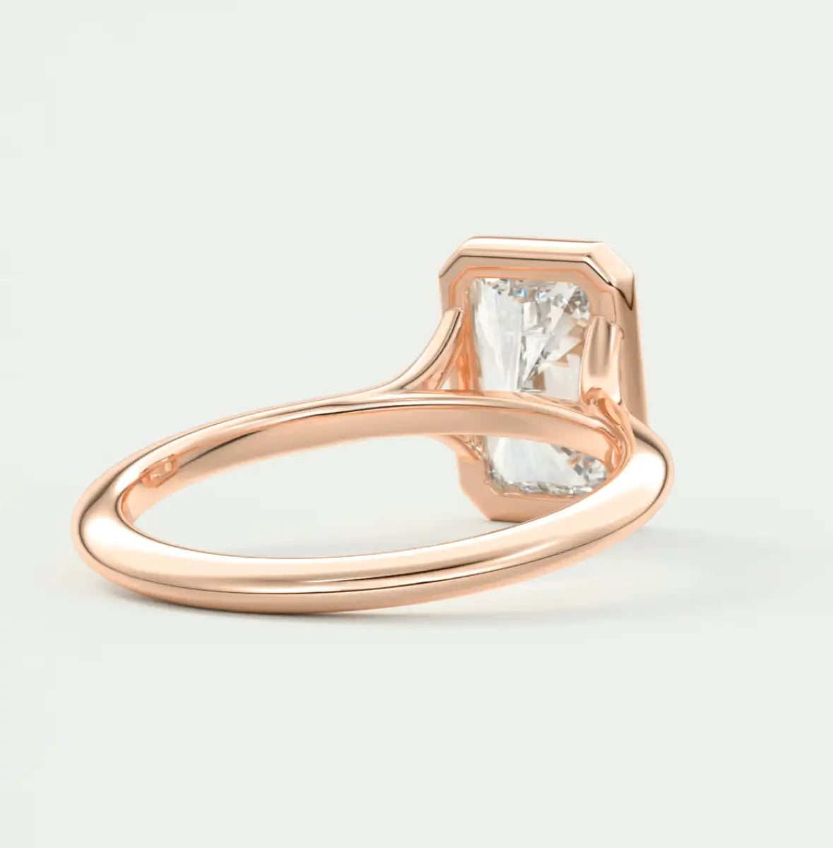 Rose gold engagement ring with princess cut diamond and small diamonds on band