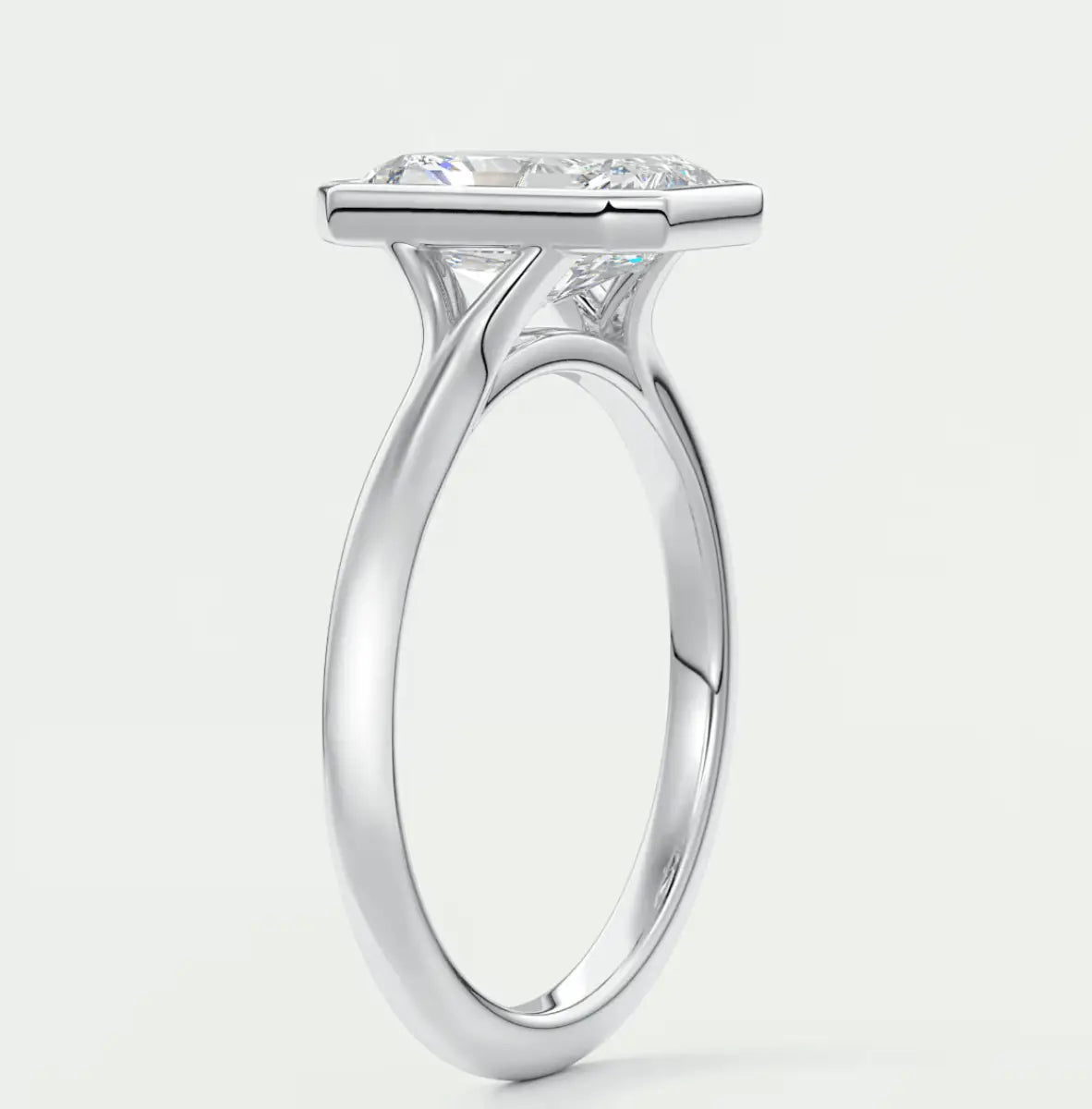 White gold princess cut diamond engagement ring with a halo design.